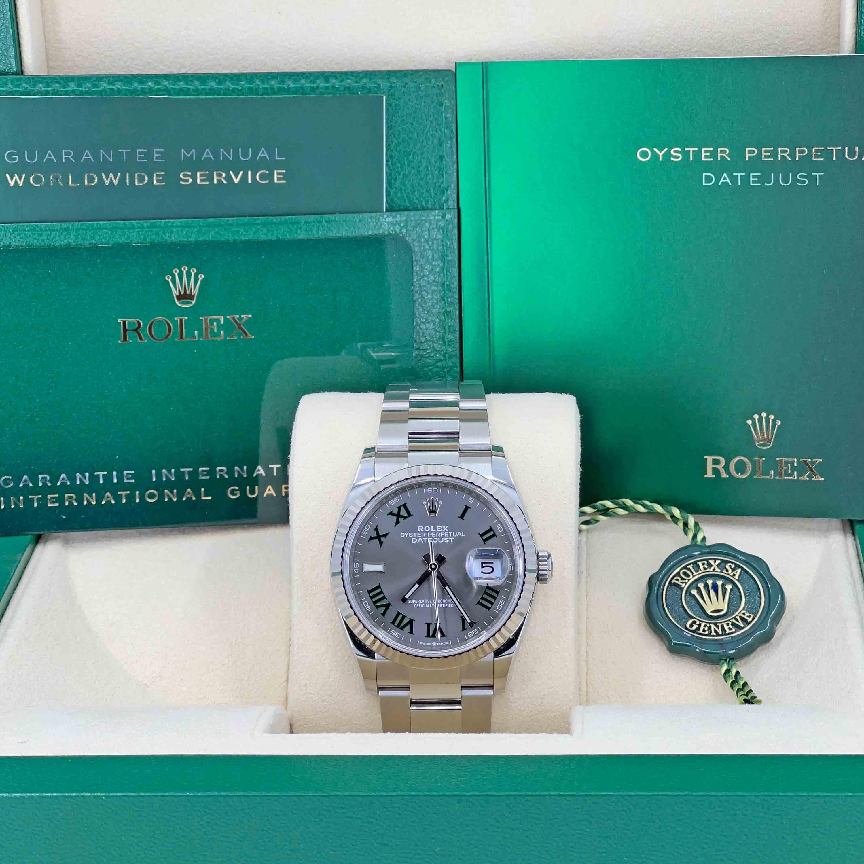 Rolex Steel Datejust 36 Watch - Fluted Bezel - Green Slate Dial - Oyster Bracelet

This watch is unworn with no signs of wear and comes with an original Rolex watch box, Manual and Warranty booklets, green COSC tag and Rolex Warranty Card. Neither