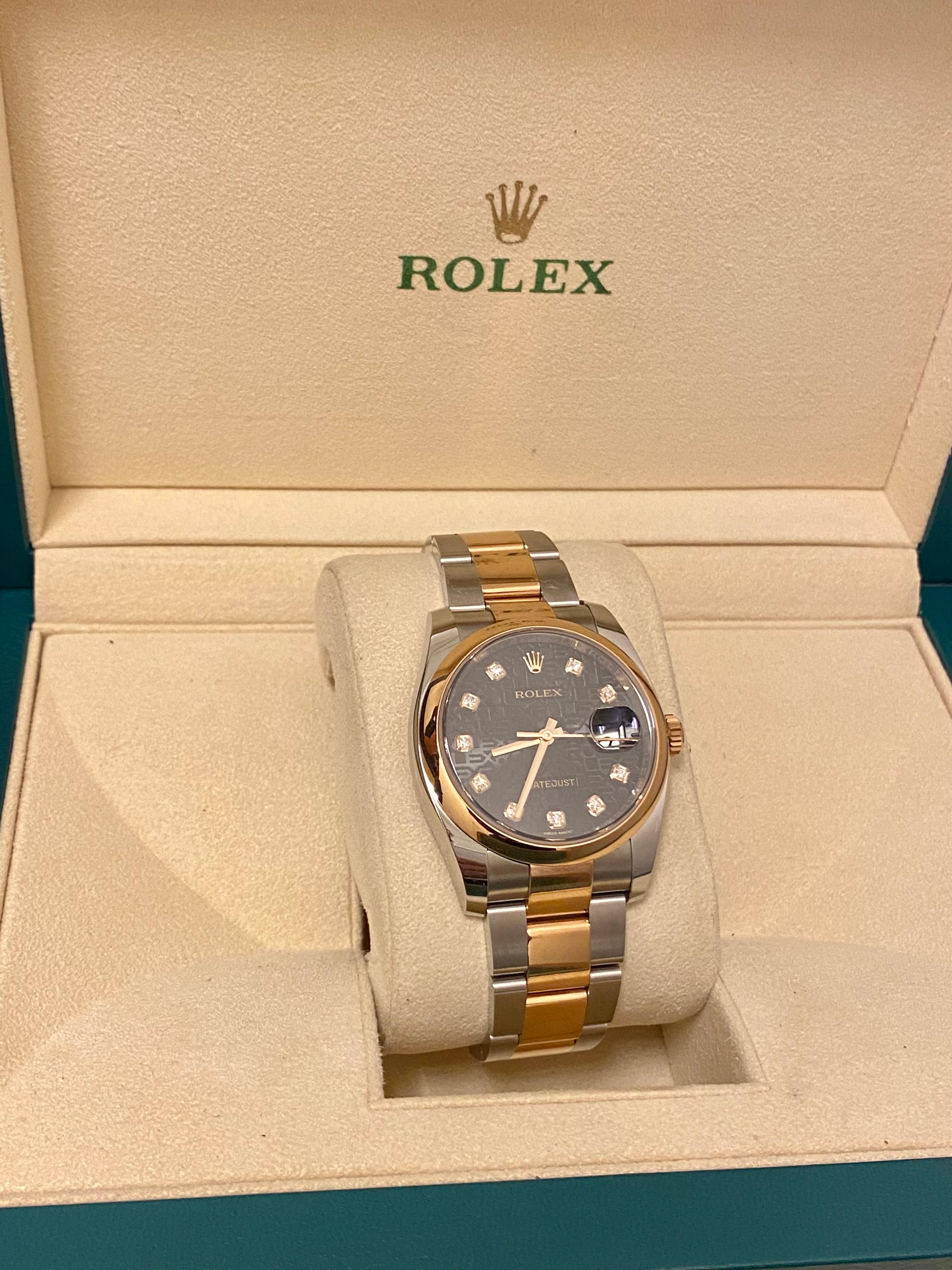 Rolex Datejust wristwatch with smooth bezel and two-tone oyster band/dial. This Rolex's significance lies in the dial. A smooth Everrose gold bezel sets the stage for a subtle, yet glossy 