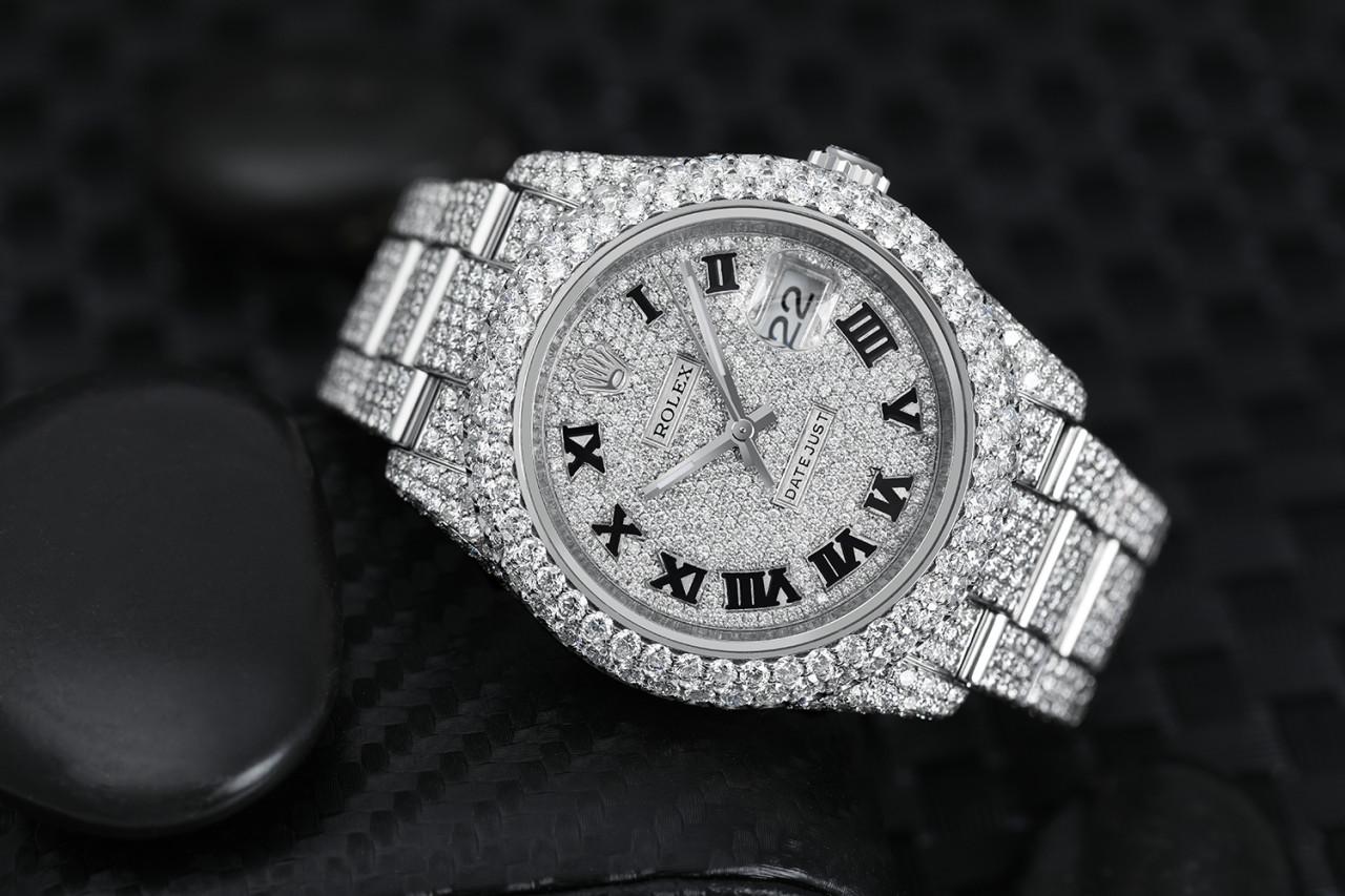 Rolex Datejust 36mm Stainless Steel Black Roman Pave Diamond Dial Fully Iced Out Watch 116234

This watch comes with a LIFETIME diamond replacement warranty. We are so confident in our diamonds setters that if any of the individual diamonds are ever