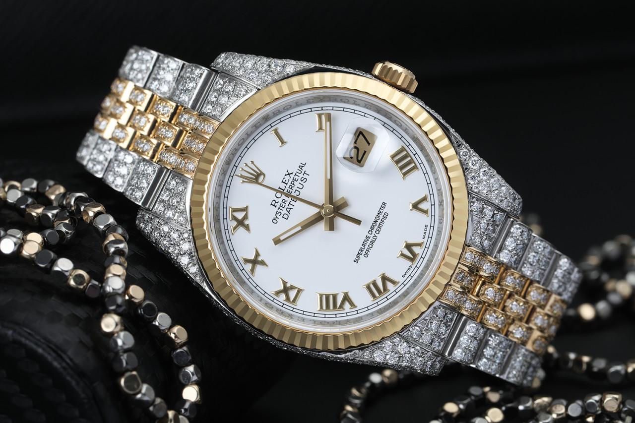 Rolex Datejust 36mm White Roman Dial Fluted Yellow Gold Bezel Iced Out Watch Jubilee Band 116233

This watch comes with a LIFETIME diamond replacement warranty. We are so confident in our diamonds setters that if any of the individual diamonds are
