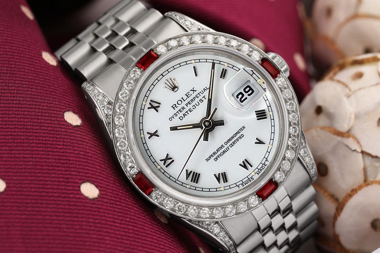 We take great pride in presenting this timepiece, which is in impeccable condition, having undergone professional polishing and servicing to maintain its pristine appearance. The watch features aftermarket diamonds (non-Rolex), and there are no