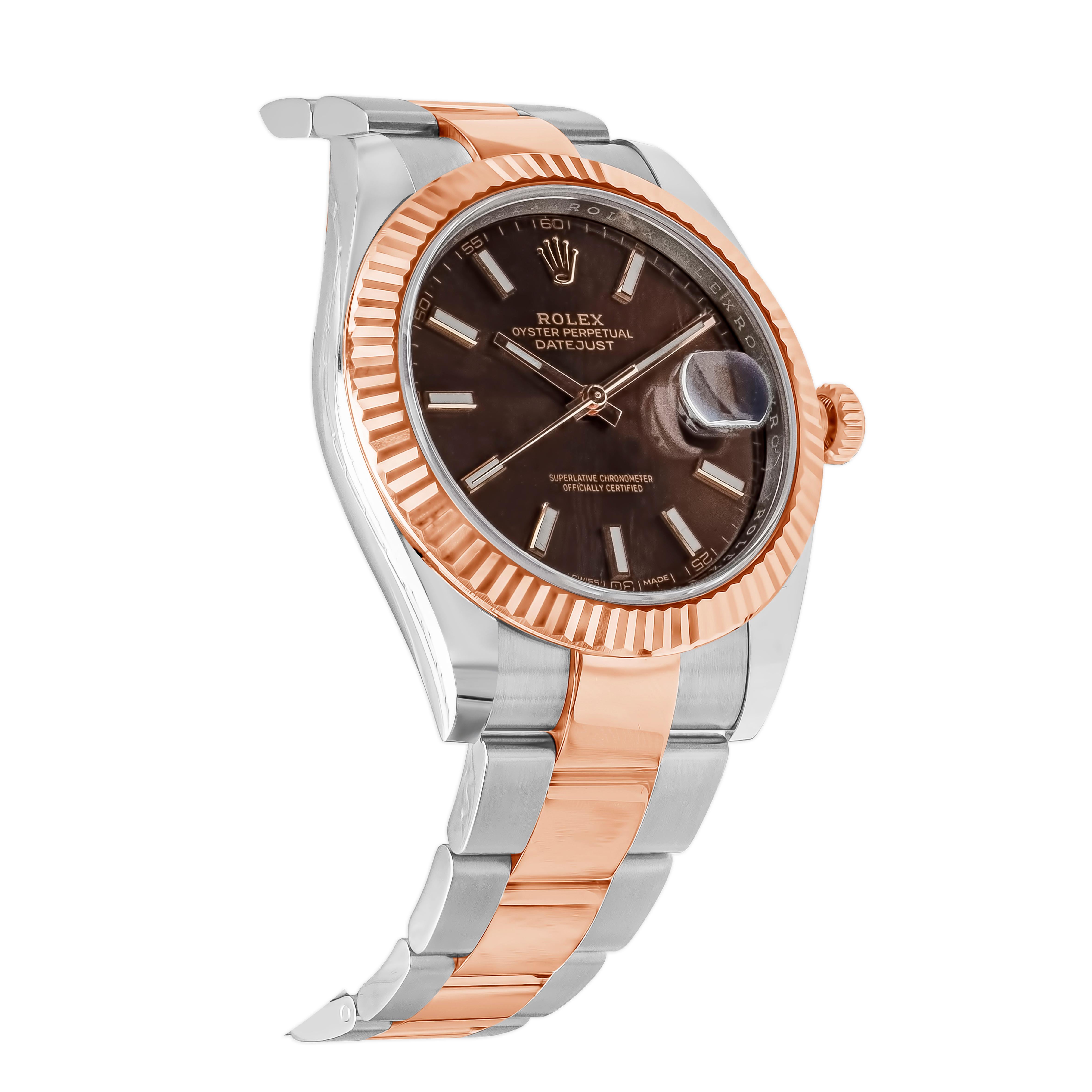 A classic model. Rolex Datejust with a 40mm stainless steel case, rose gold fluted bezel, and a chocolate brown sunburst dial. Dial set with baton hour markers and hands, date aperture on the 3 o'clock position, sapphire crystal with a cyclops