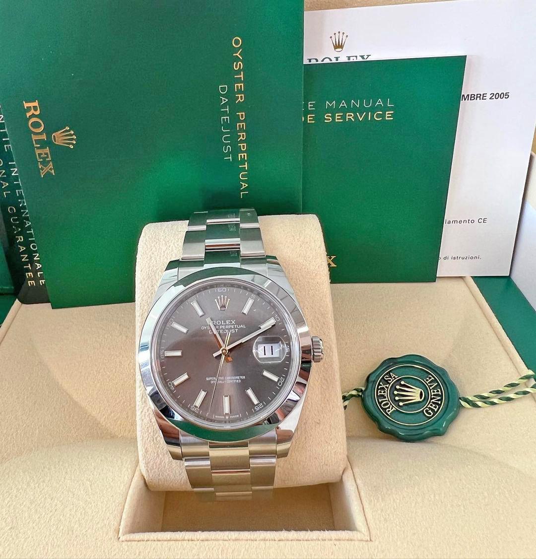 Make: Rolex
Model: Datejust 41
Reference: 126300-0007
Diameter: 41 mm
Case material: Oystersteel
Dial color: Slate
Bezel Type: Smooth
Bezel Material: Oystersteel
Crystal: Scratch-resistant sapphire, Cyclops lens over the date
Movement: Perpetual,