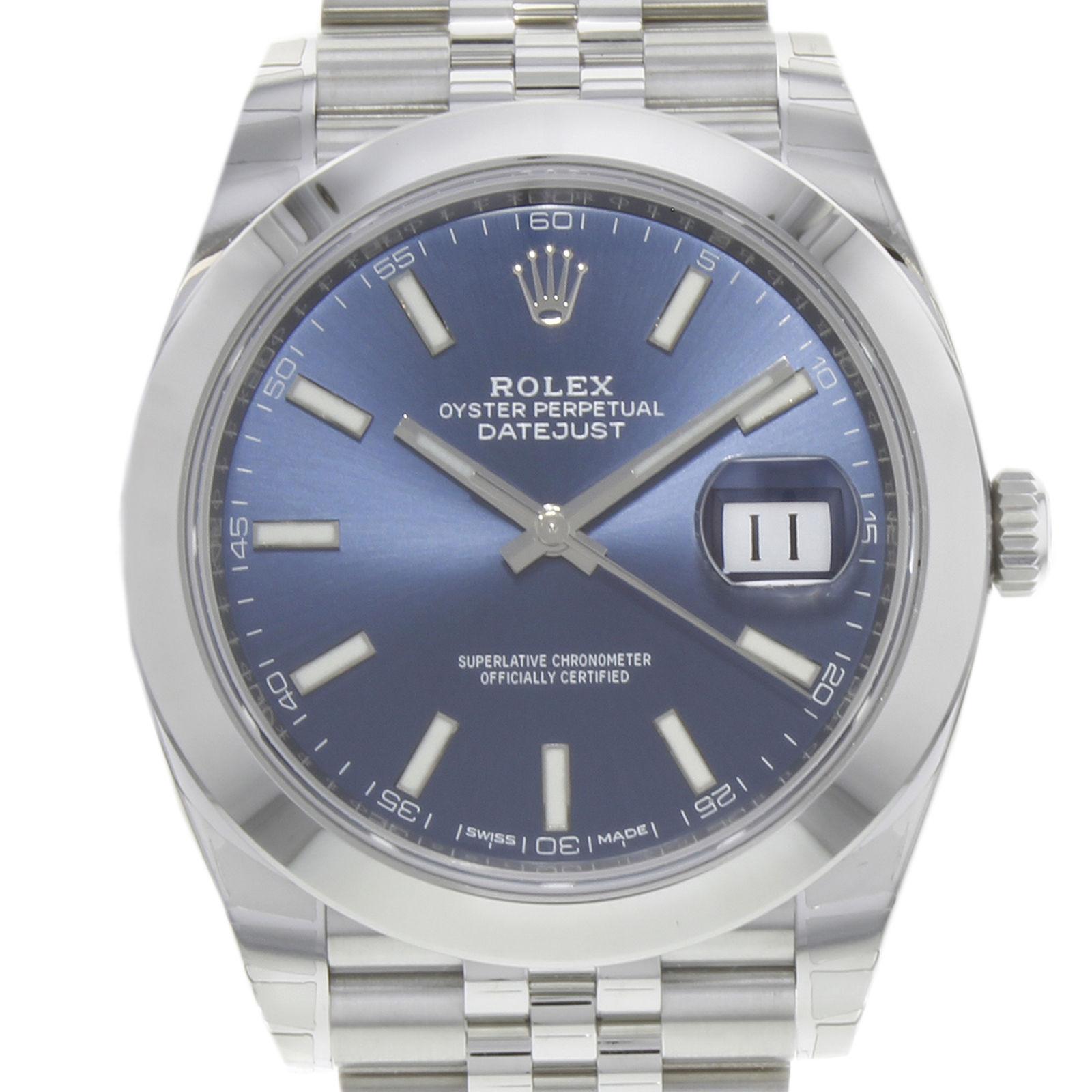(19537)
This brand new Rolex Datejust 41 126300 blij is a beautiful men's timepiece that is powered by an automatic movement which is cased in a stainless steel case. It has a round shape face, date dial and has hand sticks style markers. It is