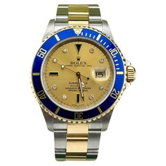 Rolex Submariner 16613 Champagne Serti Diamond Dial 18K Gold Steel Box Papers