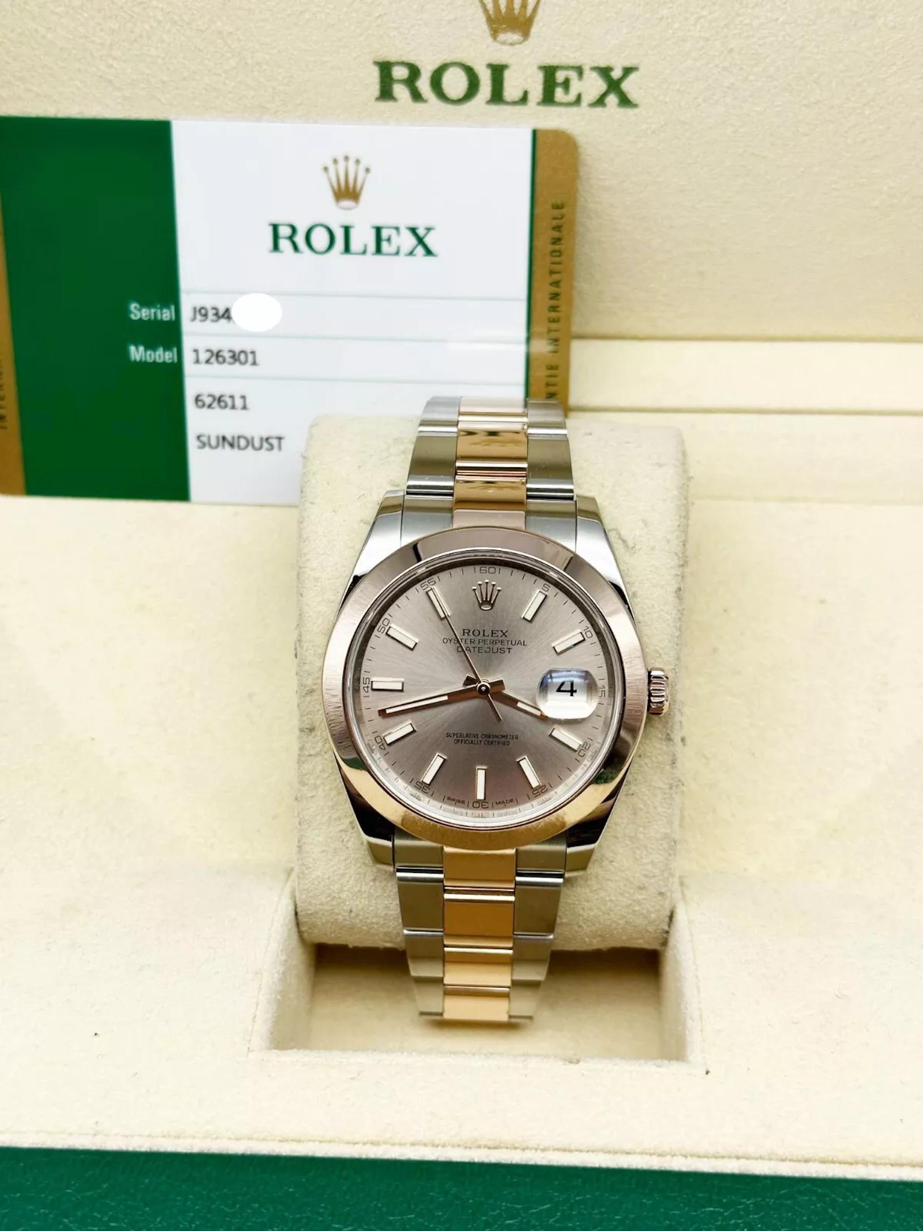 Style Number: 126301
Serial: J934P***
Year: 2019
Model: Rolex Datejust 41
Case Material: Stainless Steel 
Band: 18K Rose Gold & Stainless Steel
Bezel: 18K Rose Gold
Dial: Sundust 
Face: Sapphire Crystal
Case Size: 41mm
Includes: 
-Rolex Box and