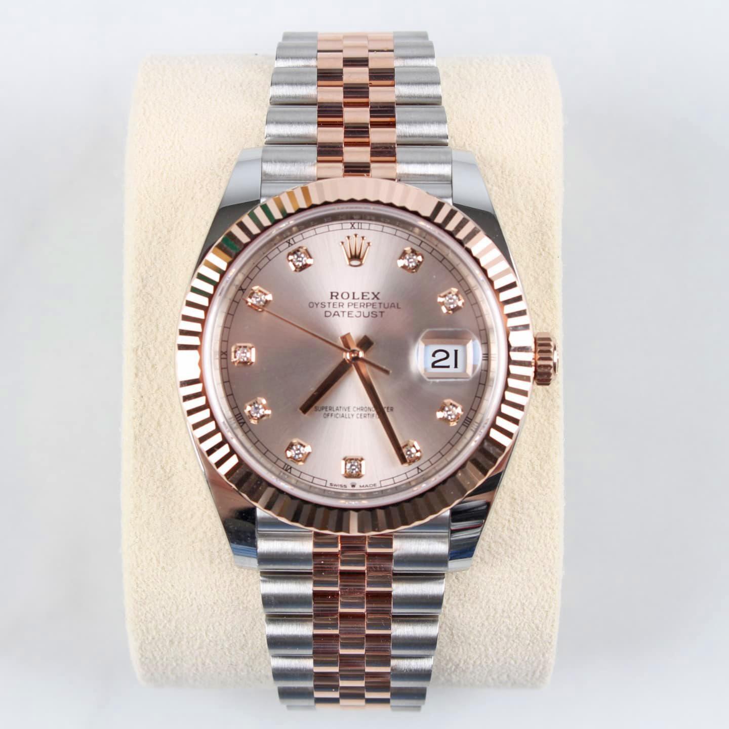Rolex Datejust 41 watch with polished 18k Everose Gold and Stainless Steel case, Reference 126331-0008. This model has Sundust dial with a fine sunray. The dial is adorned with polished 18k Everose Gold hands and Hour markers are 10 Diamonds in 18k