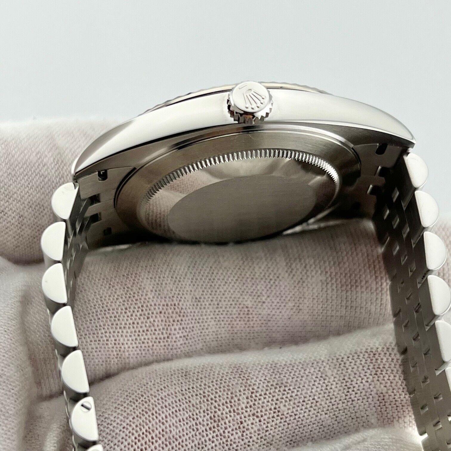 Style Number: 126334

Serial: 66P69***

Year: 2023

Model: Rolex Datejust 41

Case Material: Stainless Steel 

Band: Stainless Steel 

Bezel: 18K White Gold Fluted Bezel

Dial: Rolex Factory Black Diamond Dial 

Face: Sapphire Crystal 

Case Size: