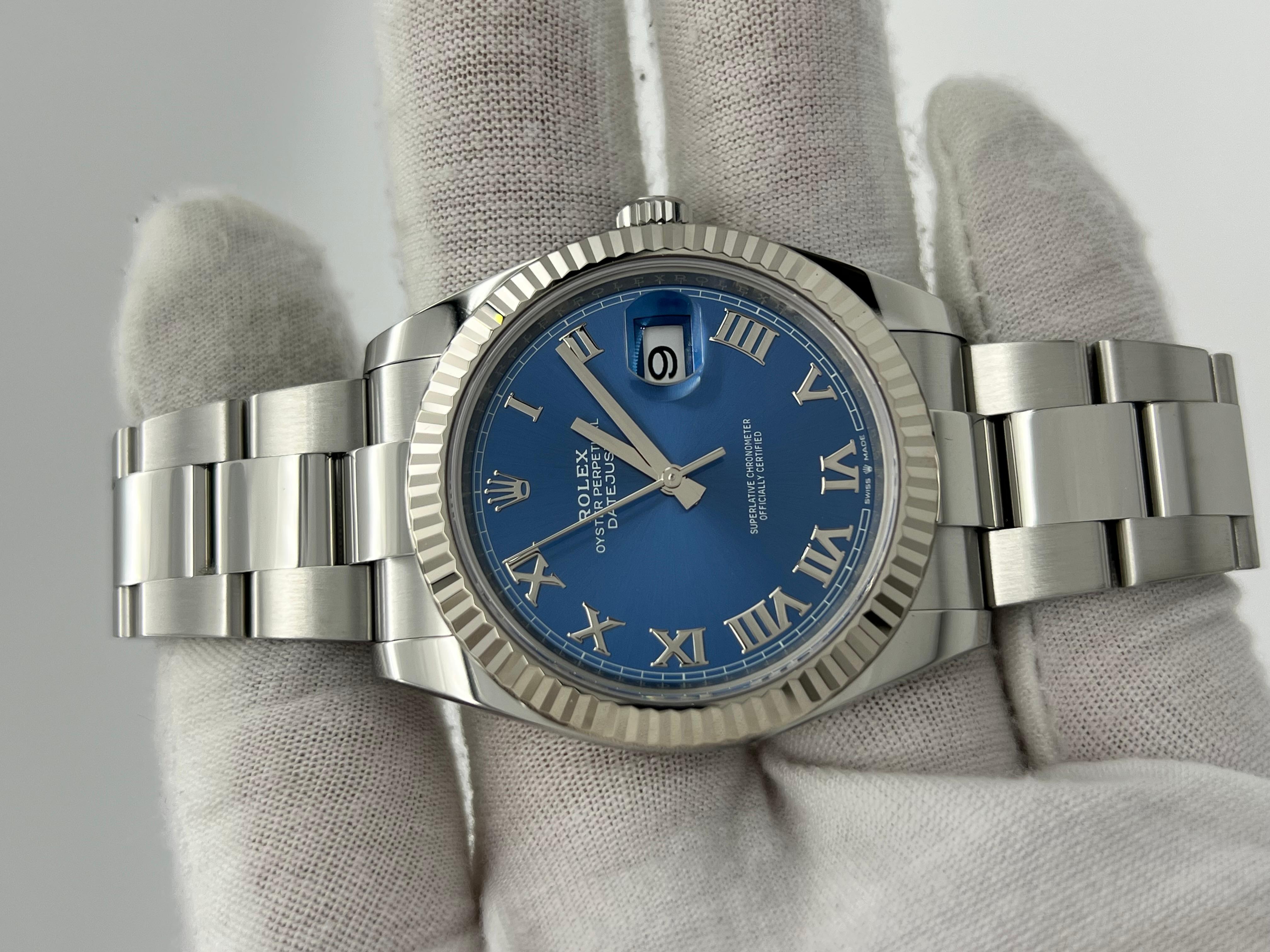 Style Number: 126334



Serial: 0185Y***



Year: 2021

 

Model: Rolex Datejust 41

 

Case Material: Stainless Steel 

 

Band: Stainless Steel 

 

Bezel: 18K White Gold Fluted Bezel 

 

Dial: Blue Roman Numerals Dial 

 

Face: Sapphire Crystal