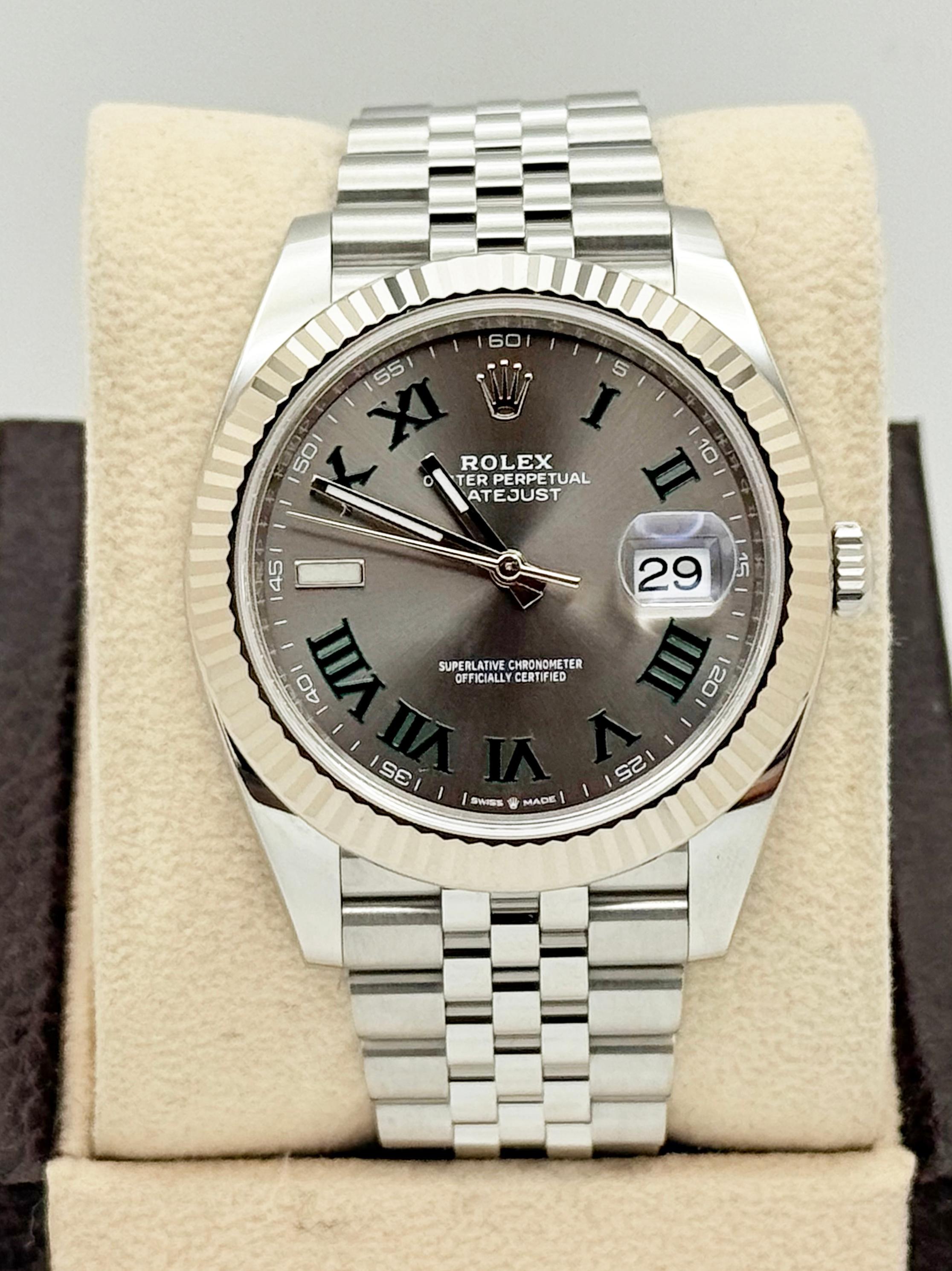 Style Number: 126334

Serial: 5JC63***

Year: 2021

Model: Rolex Datejust 41

Case Material: Stainless Steel 

Band: Stainless Steel Jubilee Band

Bezel: 18K White Gold 

Dial: Slate Wimbledon 

Face: Sapphire Crystal 

Case Size: 41mm

Includes: