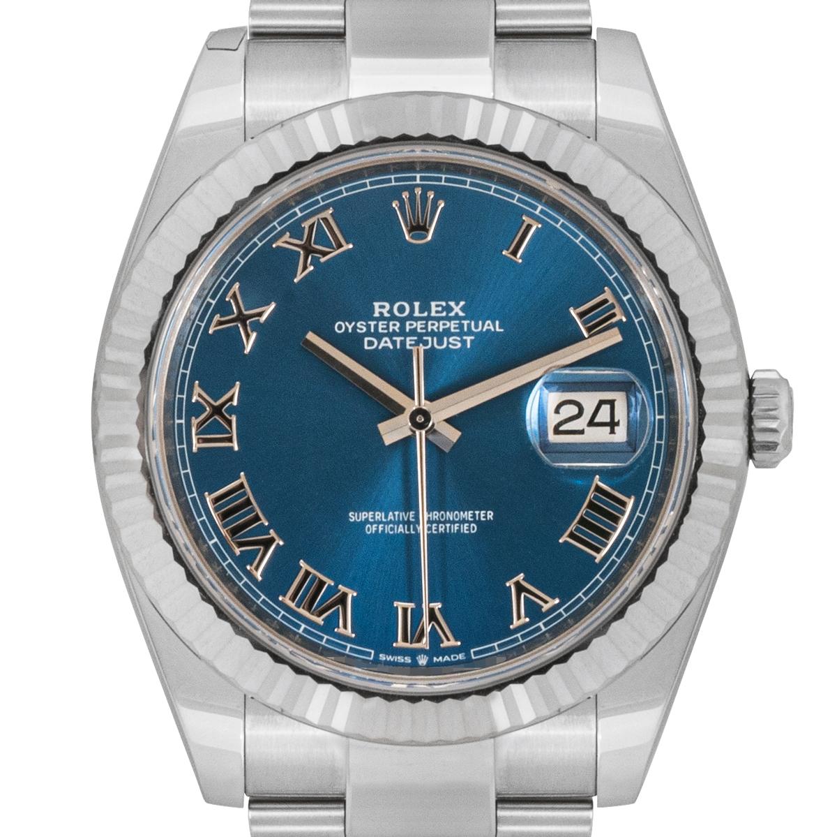 A 41mm Datejust in Oystersteel from Rolex. Features a distinctive Azzurro Blue dial with a fixed white gold fluted bezel. The Oyster bracelet comes with a folding Oysterclasp which is equipped with the Easylink 5mm comfort extension link. Fitted