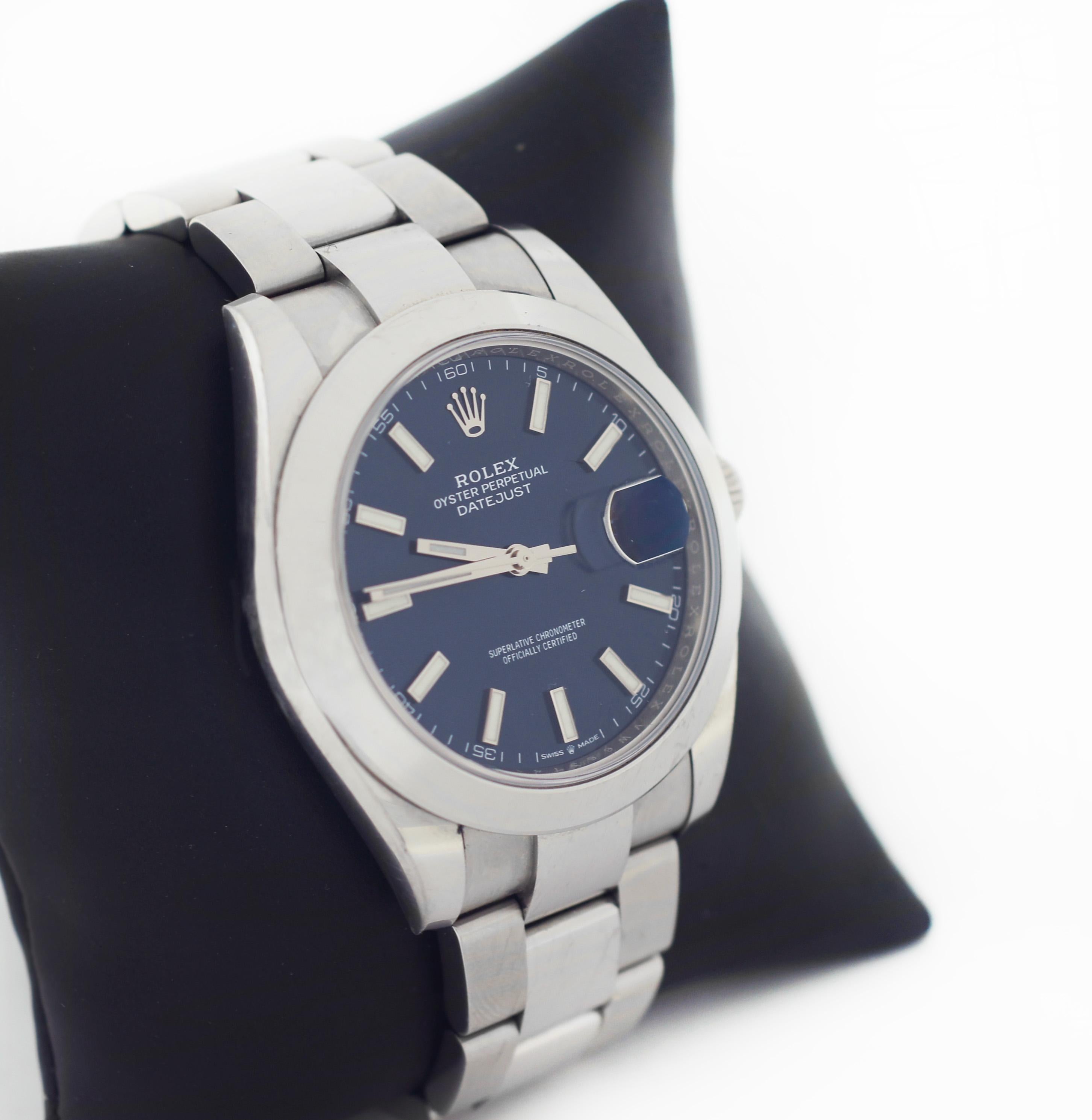 ROLEX
Datejust
Oyster Perpetual
126300
Blue Dial
Luminescent Stainless Steel Hands & Hour Markers
Polished Stainless Steel Fixed Bezel Case
Date Feature at 3 o'clock mark
Officially certified chronometer automatic self-winding movement
Sapphire
