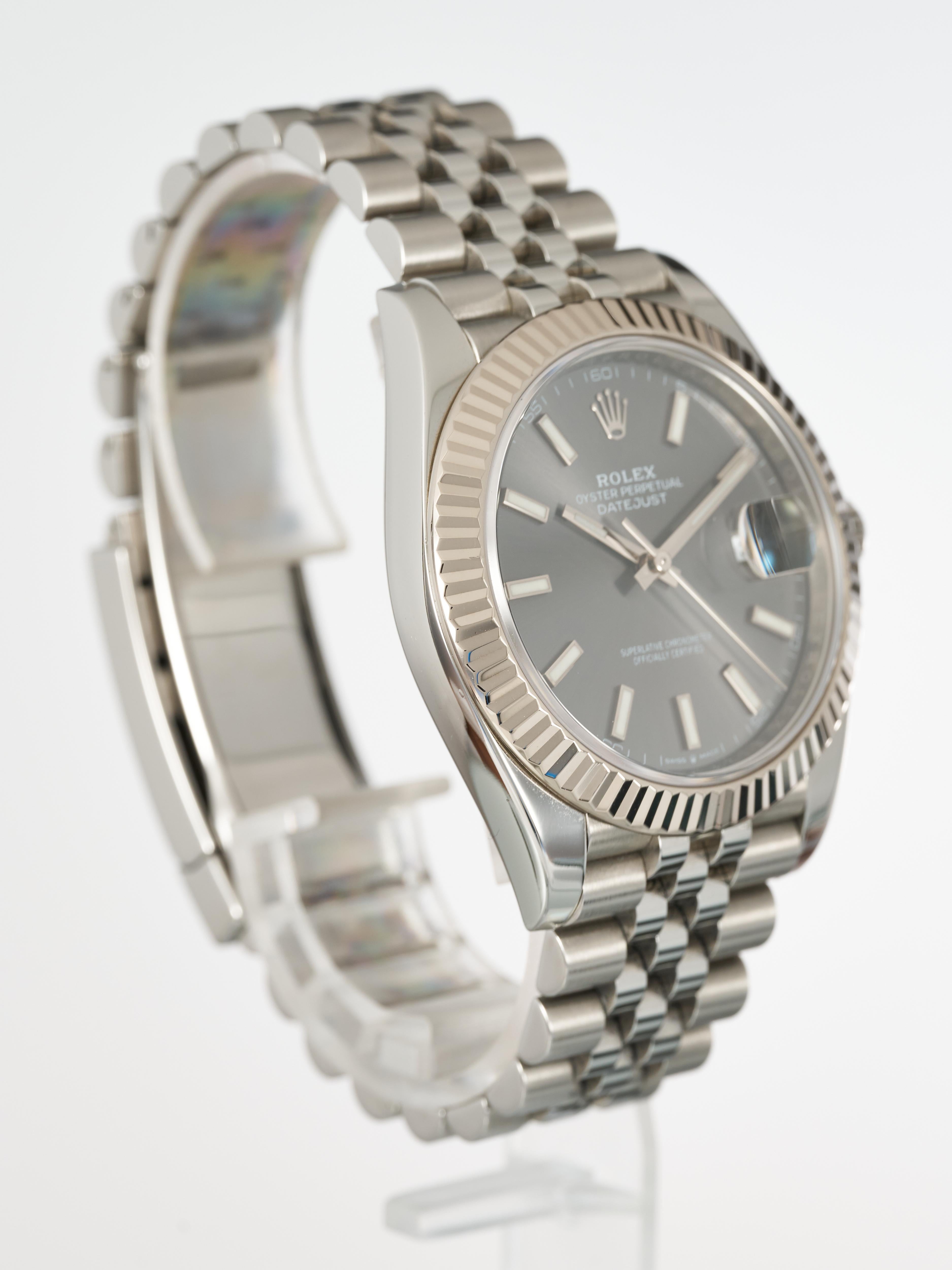 Fork In Time is proud to offer on the 1st Dibs marketplace:

Rolex 
Datejust 41 
Rhodium Slate Grey Baton Sunburst Dial 
18K White Gold Fluted Bezel 
Jubilee Bracelet 

Full Set:
Double Boxed, Papers, Manuals & Both Swing Tags
 
Warranty Card Dated