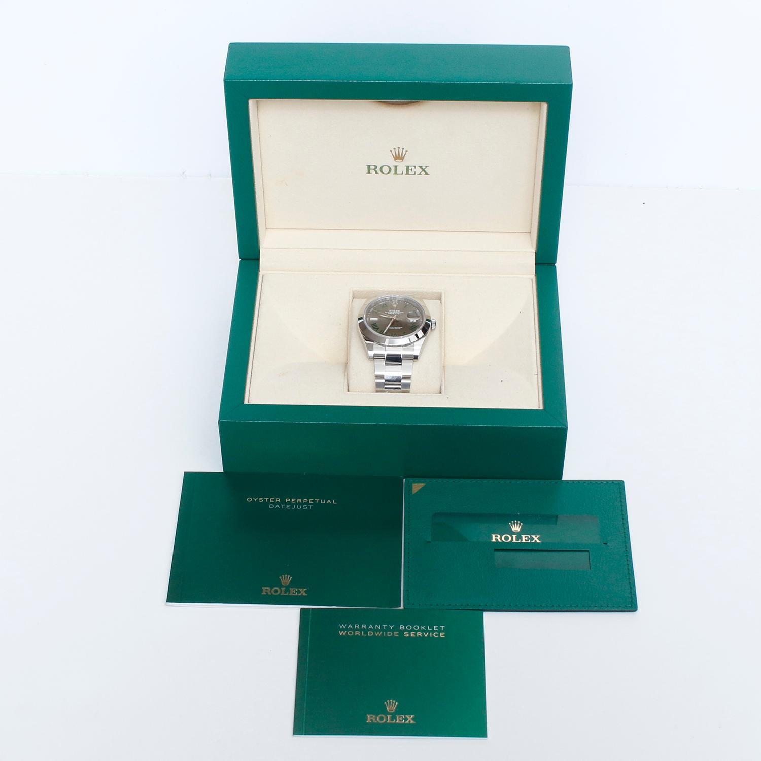 Rolex Datejust II Men's 41mm Stainless Steel 126300 Wimbledon Dial - Automatic winding, sapphire crystal. Stainless steel case (41mm diameter). Silver dial with Green Romans markers. Stainless steel Oyster bracelet. Pre-owned Rolex box and card.