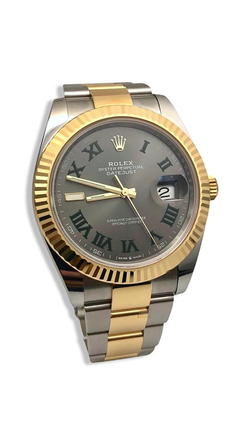 Brand: Rolex

Collection: Datejust 41

Reference: 126333

Year: 2021

Movement:  Automatic Self Winding

Case Material: Stainless Steel

Case Size: 41mm

Dial Color: Slate 

Hour Markers:  Green Roman Numeral Hour Markers

Hands: Luminescence