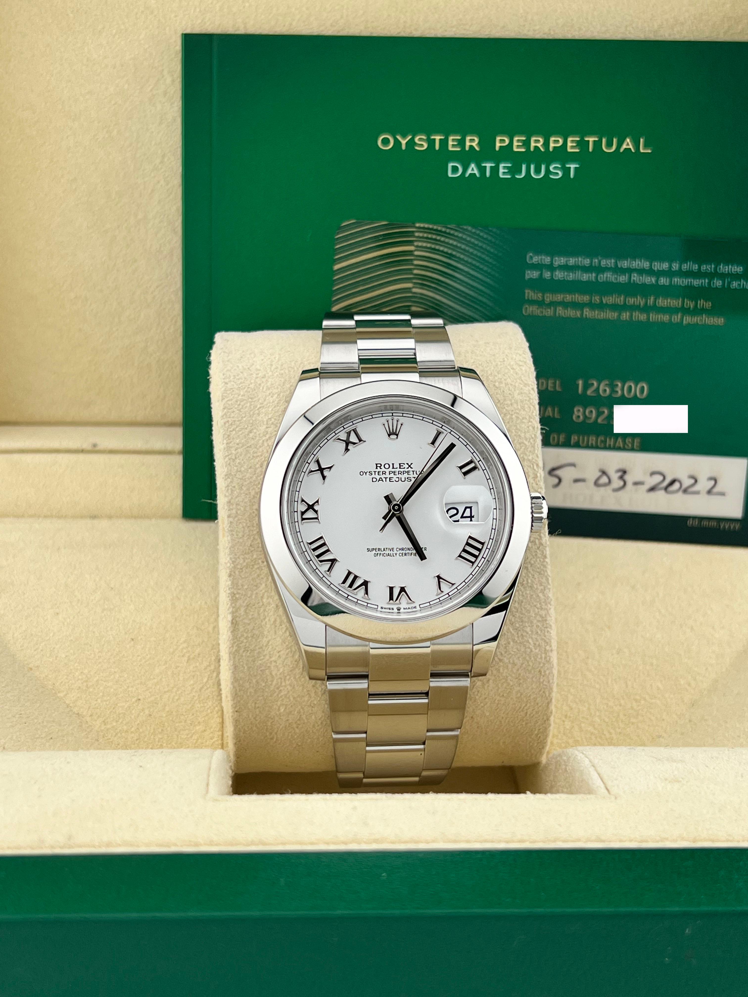 Style Number: 126300
Serial: 8923C***
Year: 2022
Model: Rolex Datejust 41
Case Material: Stainless Steel 
Band: Stainless Steel 
Bezel: Stainless Steel Smooth Bezel 
Dial: White with Roman Numerals 
Face: Sapphire Crystal 
Case Size: 41mm 
Includes:
