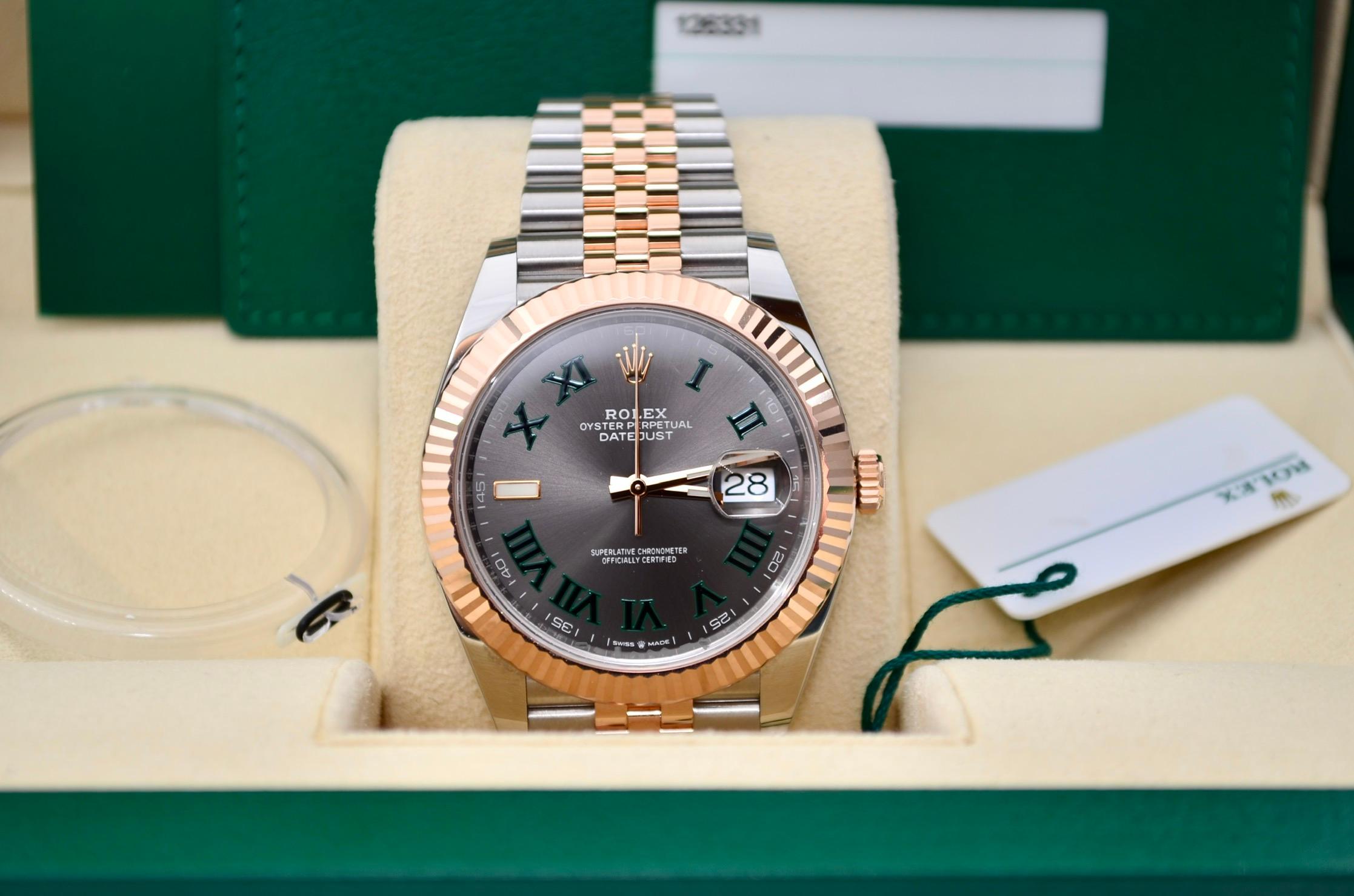 The watch is in a very good condition and it’s working well. It shows slight signs of wear. The watch comes with the original box and documents. Manufacturer warranty is valid until 2024. The Rolex Datejust 41 Wimbledon Rose Gold & Steel Full Set
