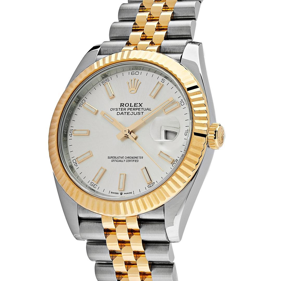 The Rolex Datejust is designed with a 41mm stainless steel case, highlighted by the distinctive yellow gold fluted bezel. It features a silver dial with luminous hour markers, yellow gold hands and date display at 3 o'clock protected by a