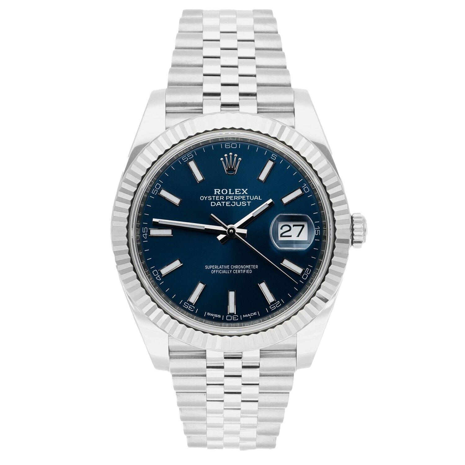 Stainless steel case with a stainless steel Rolex jubilee bracelet. Fixed fluted 18kt white gold bezel. Blue dial with silver-tone hands and index hour markers. Minute markers around the outer rim. Dial Type: Analog. Date display at the 3 o'clock