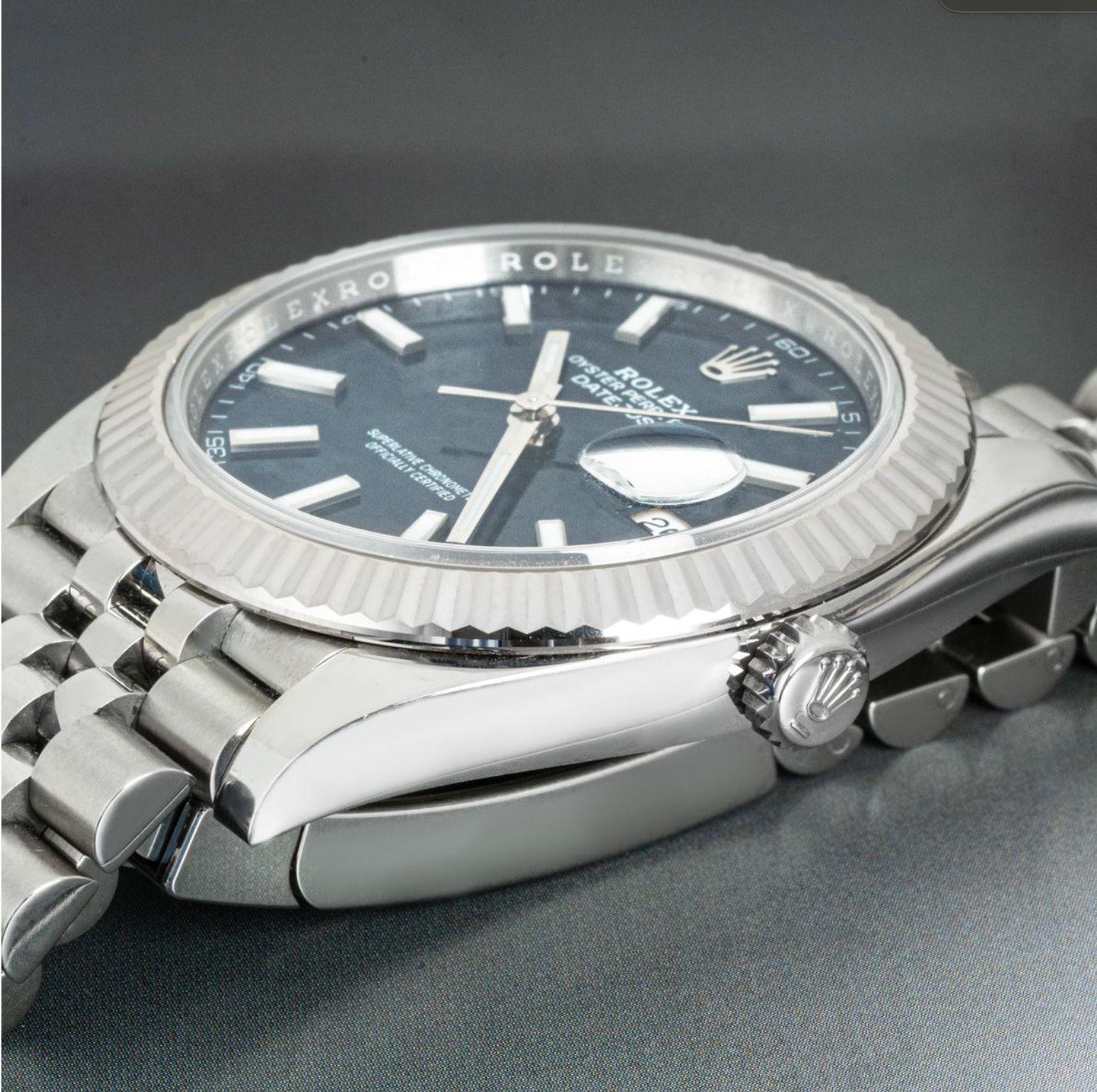 An Oystersteel 41mm Datejust by Rolex. Featuring a blue fluted motif dial, with applied hour markers and a white gold fluted bezel. The watch is fitted with a scratch-resistant sapphire glass, a self-winding automatic movement and a Jubilee bracelet