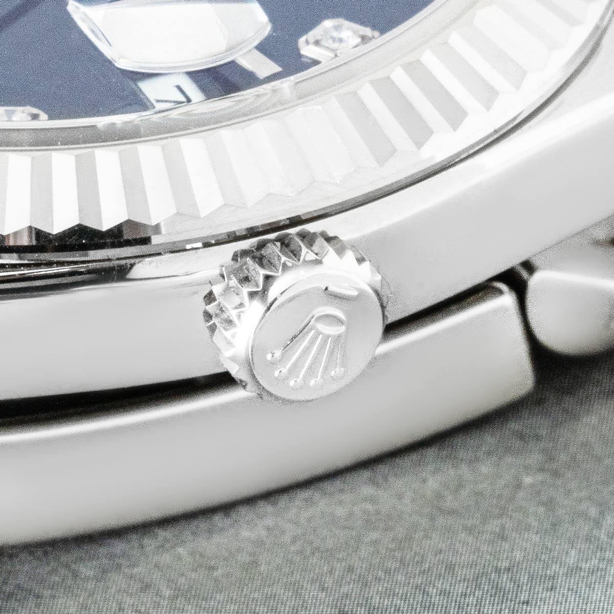 A 41mm Datejust by Rolex. Featuring a bright blue dial with diamond set hour markers and a fluted white gold bezel. Fitted with scratch-resistant sapphire crystal and a self-winding automatic movement. This watch is presented on a Jubilee bracelet