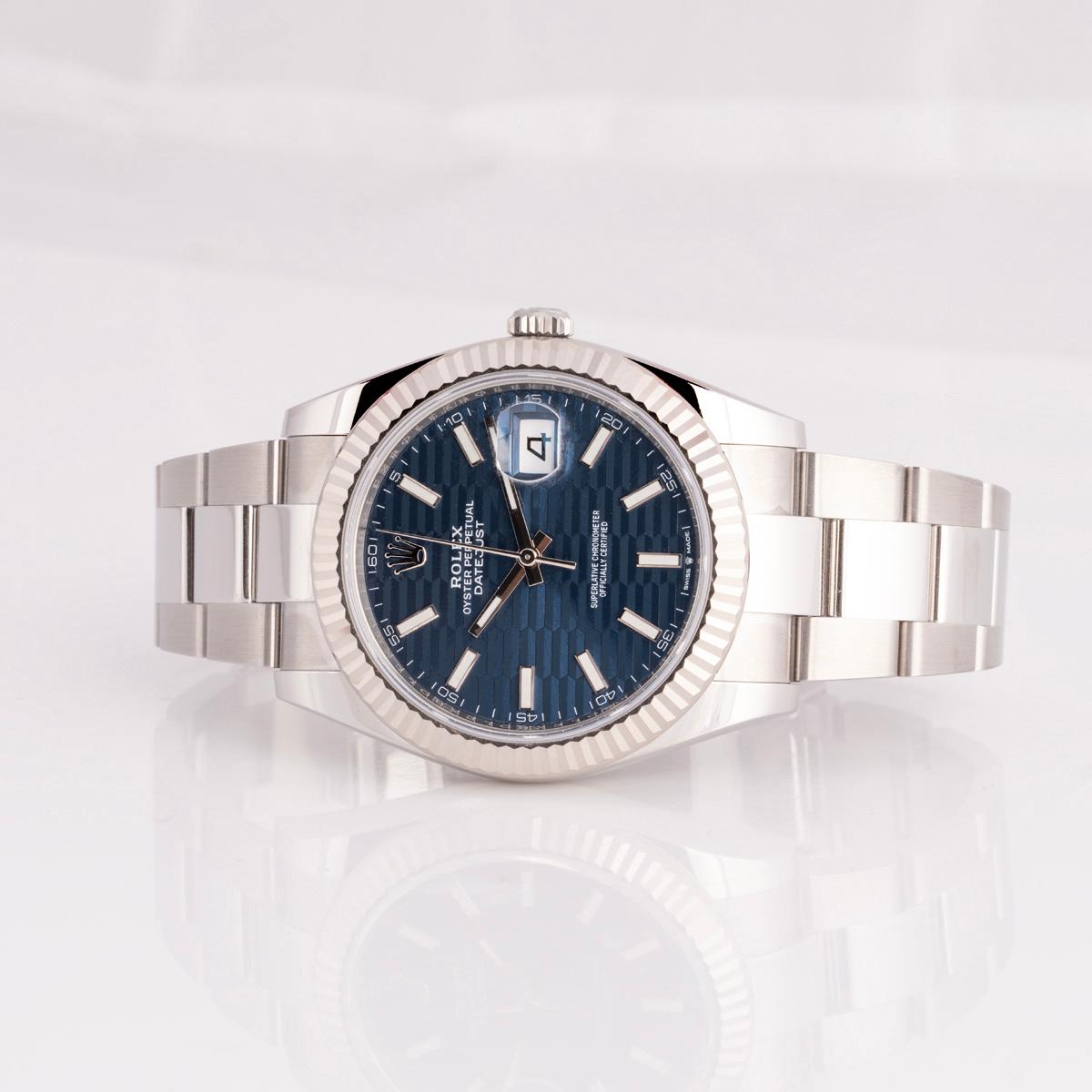 A stainless steel Datejust 41 by Rolex. Features the discontinued blue fluted motif dial with applied hour markers, complemented by a white gold fluted bezel. The watch is fitted with scratch-resistant sapphire crystal, a self-winding automatic