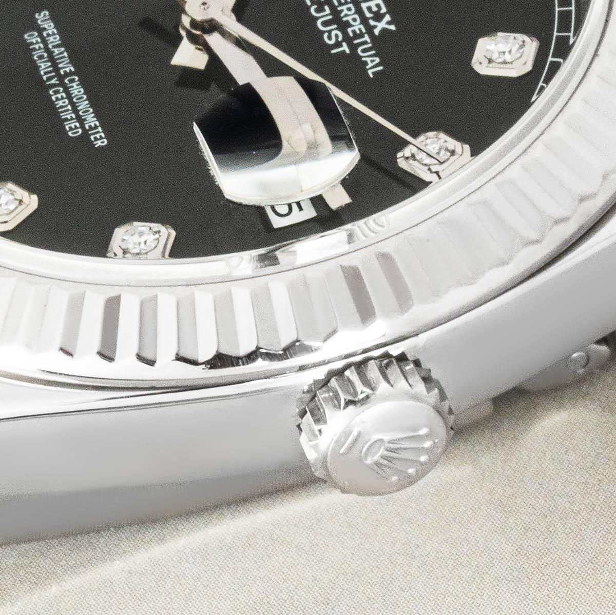 A 41mm Datejust by Rolex. Featuring a black dial with diamond set hour markers and a white gold fluted bezel. Fitted with scratch-resistant sapphire crystal and a self-winding automatic movement. The watch also features a Jubilee bracelet that is