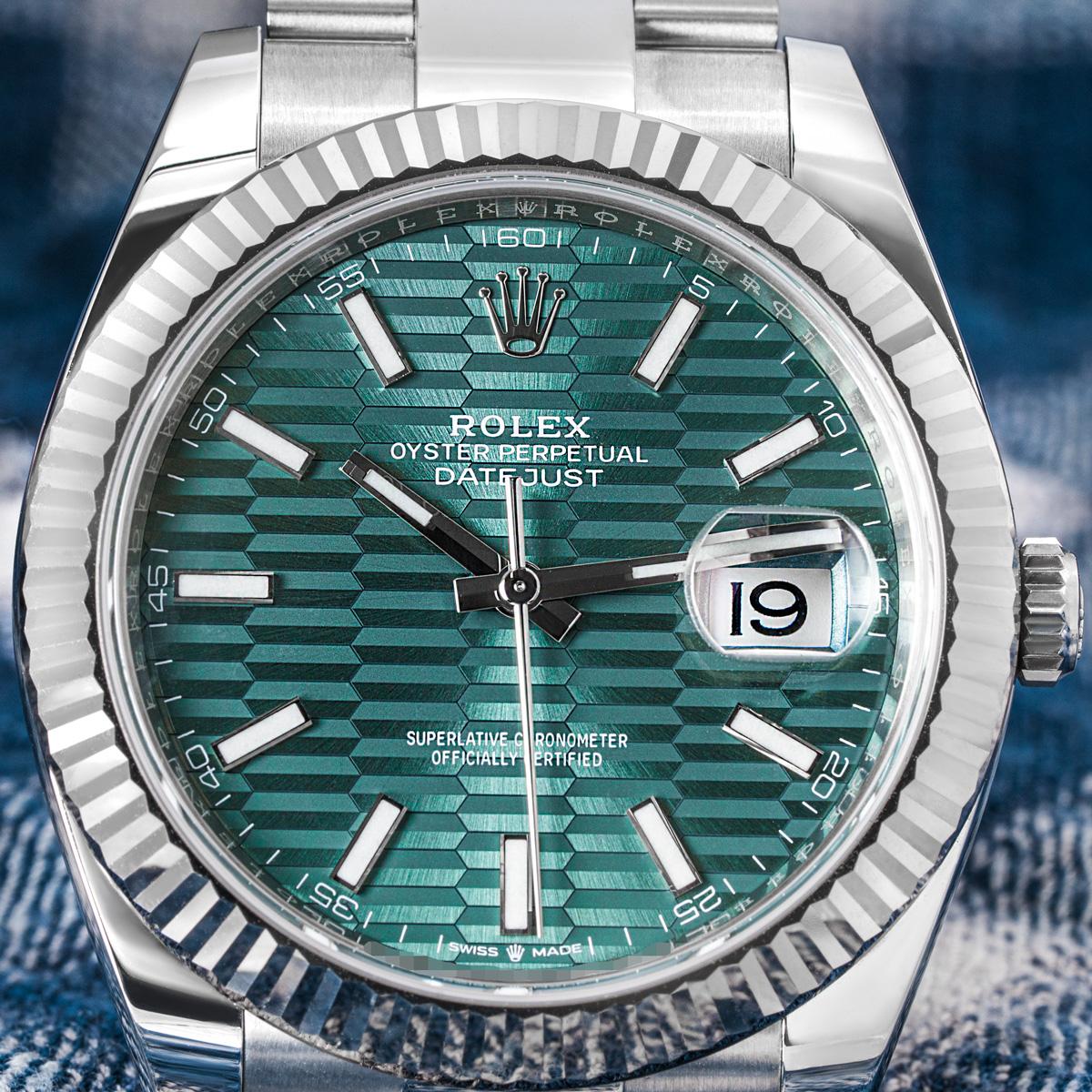 An unworn 41mm stainless steel Datejust by Rolex. Featuring a distinctive mint green fluted motif dial with applied hour markers and a white gold fluted bezel. Fitted with a sapphire glass, a self-winding automatic movement and an Oyster bracelet