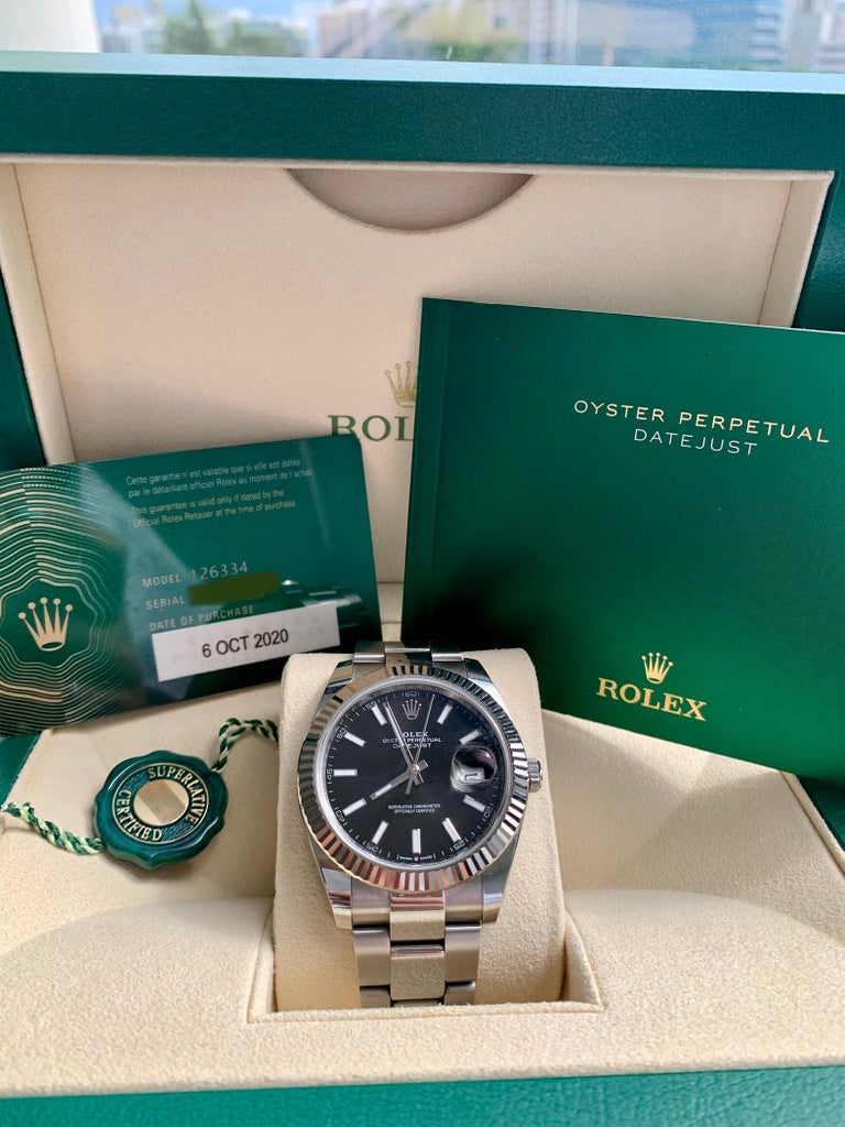 Rolex Datejust 41 in stainless steel with 18k white gold fluted bezel. Auto w/ sweep seconds and date. 41 mm case size. Ref 126334.  Rolex Datejust 41 126334 watch is made out of Stainless steel on a Stainless Steel bracelet with a Stainless Steel