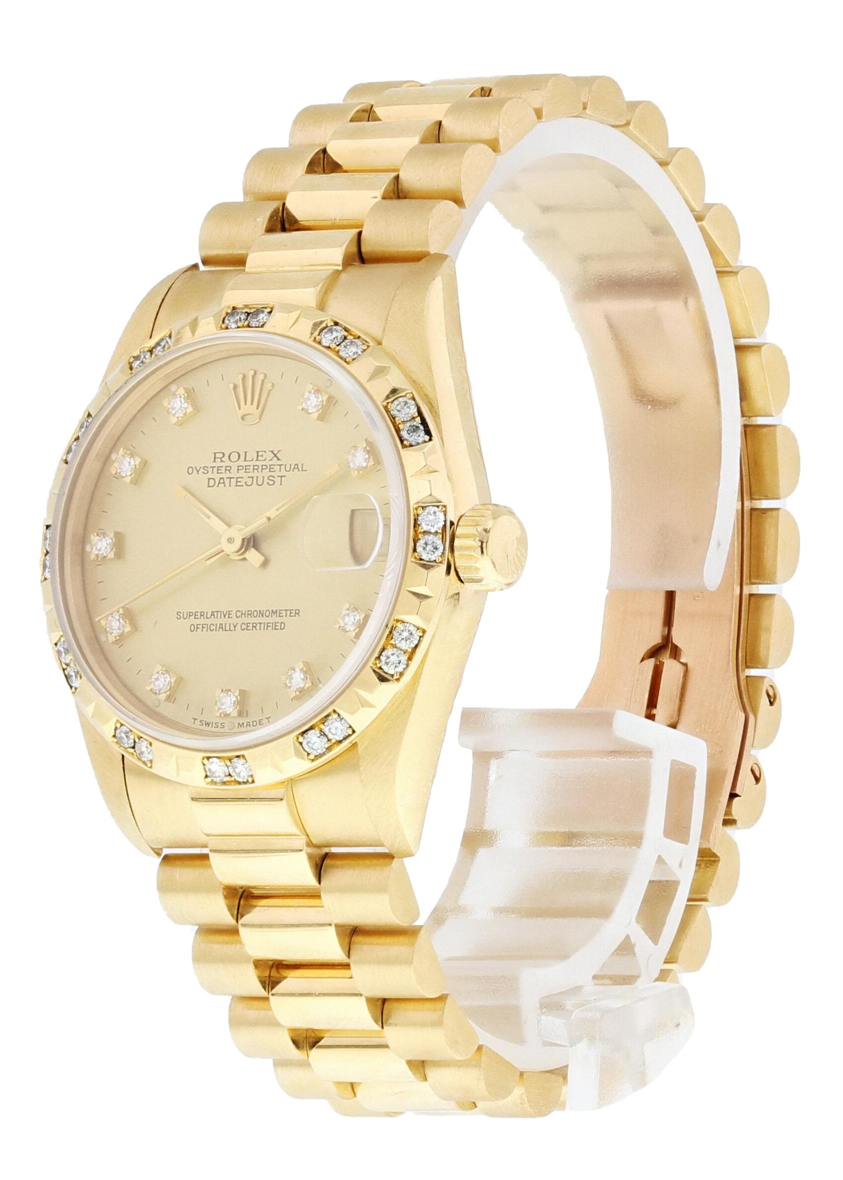 Rolex Oyster Perpetual Datejust 68258 18K Midsize Ladies Watch. 31mm 18k yellow gold case. Fluted bezel with factory placed diamonds. Champagne dial with gold hands and Factory placed diamonds. Quickset date display at the 3 o'clock position. 18K