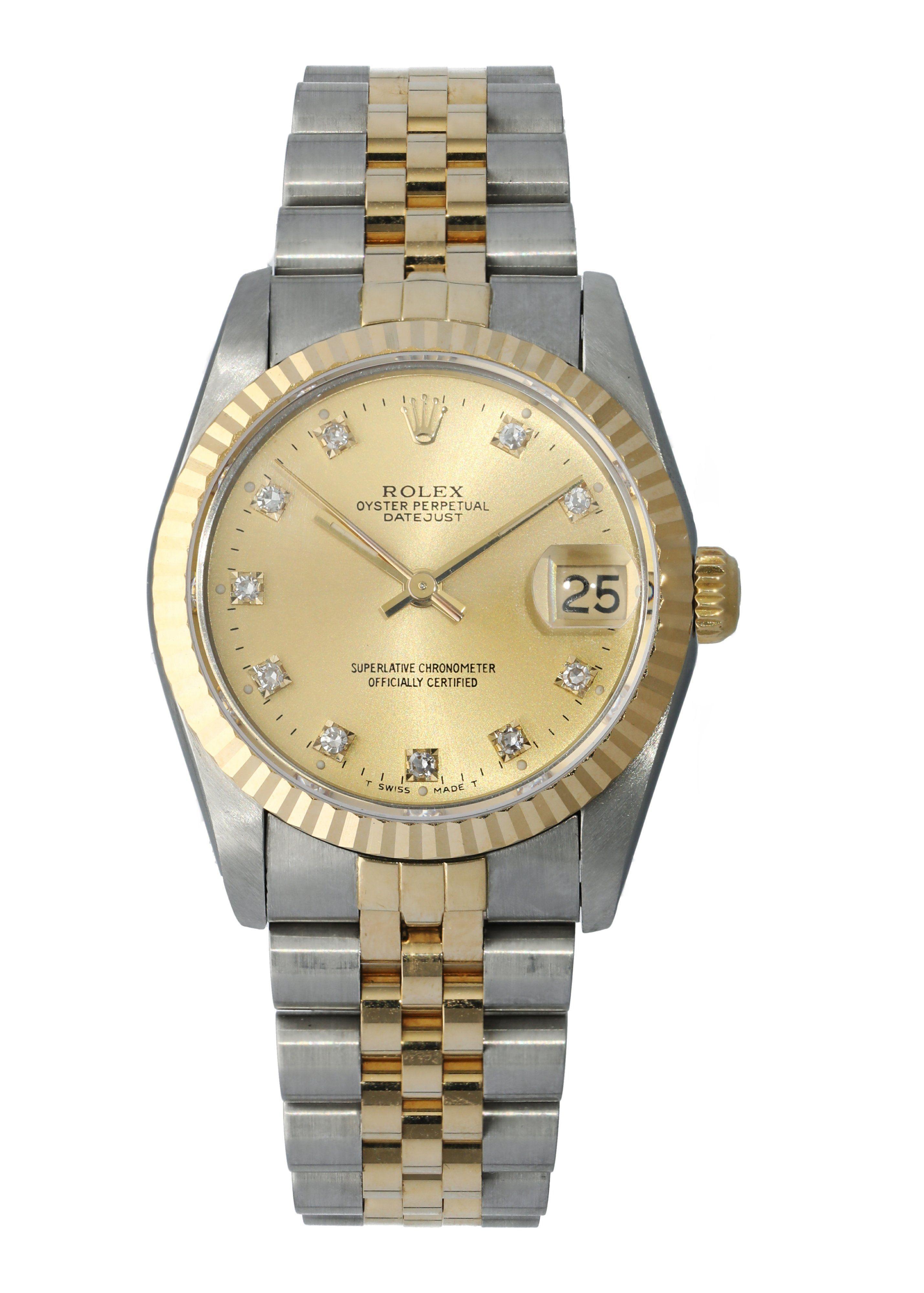 Rolex Datejust 68273 Diamond Dial Ladies Watch.
31mm Stainless Steel case.
Yellow Gold fluted bezel.
Champagne dial with luminous gold hands and factory set diamond hour markers.
Minute markers on the outer dial.
Date display at the 3 o'clock
