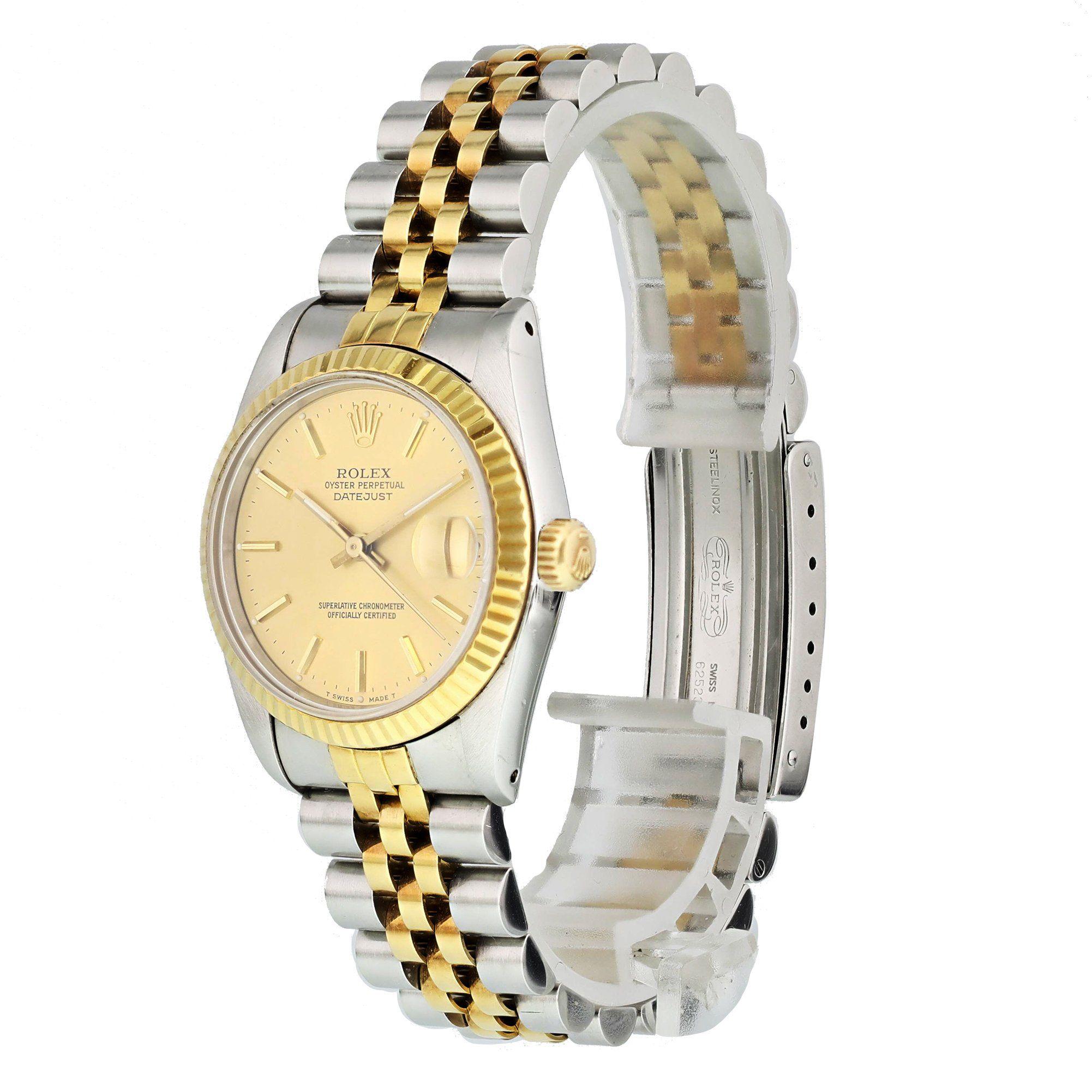 Rolex Datejust 68273 Midsize Ladies Watch. 
31mm Stainless Steel case. 
Yellow Gold Stationary fluted bezel. 
Champagne dial with gold hands and index hour markers. 
Minute markers on the outer dial. 
Date display at the 3 o'clock position.