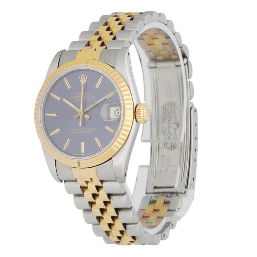 Rolex Datejust 68273 Midsize ladies Watch. 30mm Stainless Steel case with 18K yellow gold fluted bezel. Blue dial with luminous gold hands and index hour markers. Stainless Steel & 18K yellow gold Jubilee Bracelet with Fold Over Clasp. Will fit up
