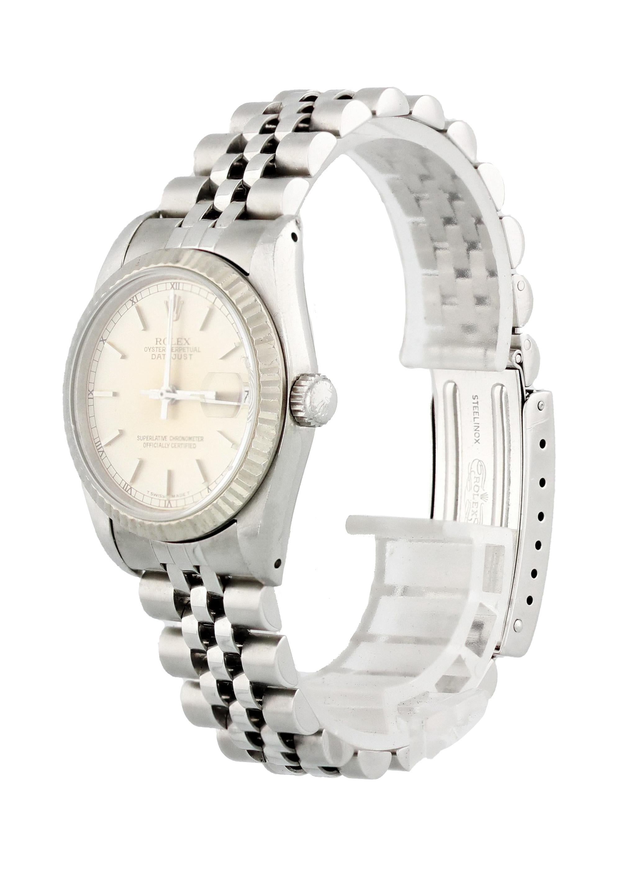 Rolex Datejust 68274 Ladies Watch. 31mm Stainless Steel case. Yellow Gold Stationary bezel. Silver dial with Steel hands and index hour markers. Minute markers on the outer dial. Date display at the 3 o'clock position. Stainless Steel Bracelet with