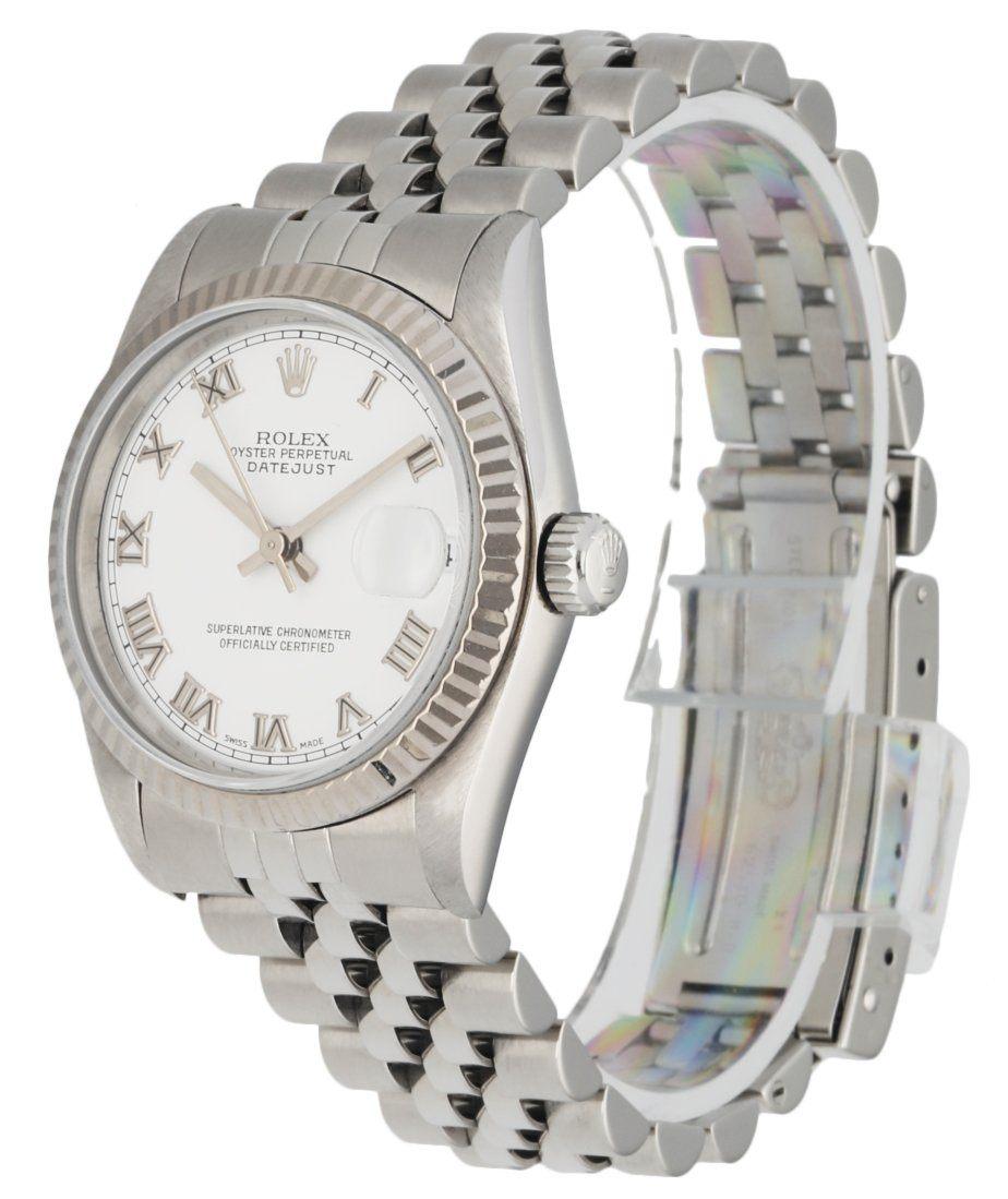 Rolex Datejust 68274 ladies watch. 31mm stainless steel case. 18k White Gold fluted bezel. White dial with steel hands and Roman numeral hour markers. Minute markers on the outer dial. Date display at the 3 o'clock position. Stainless Steel Jubilee
