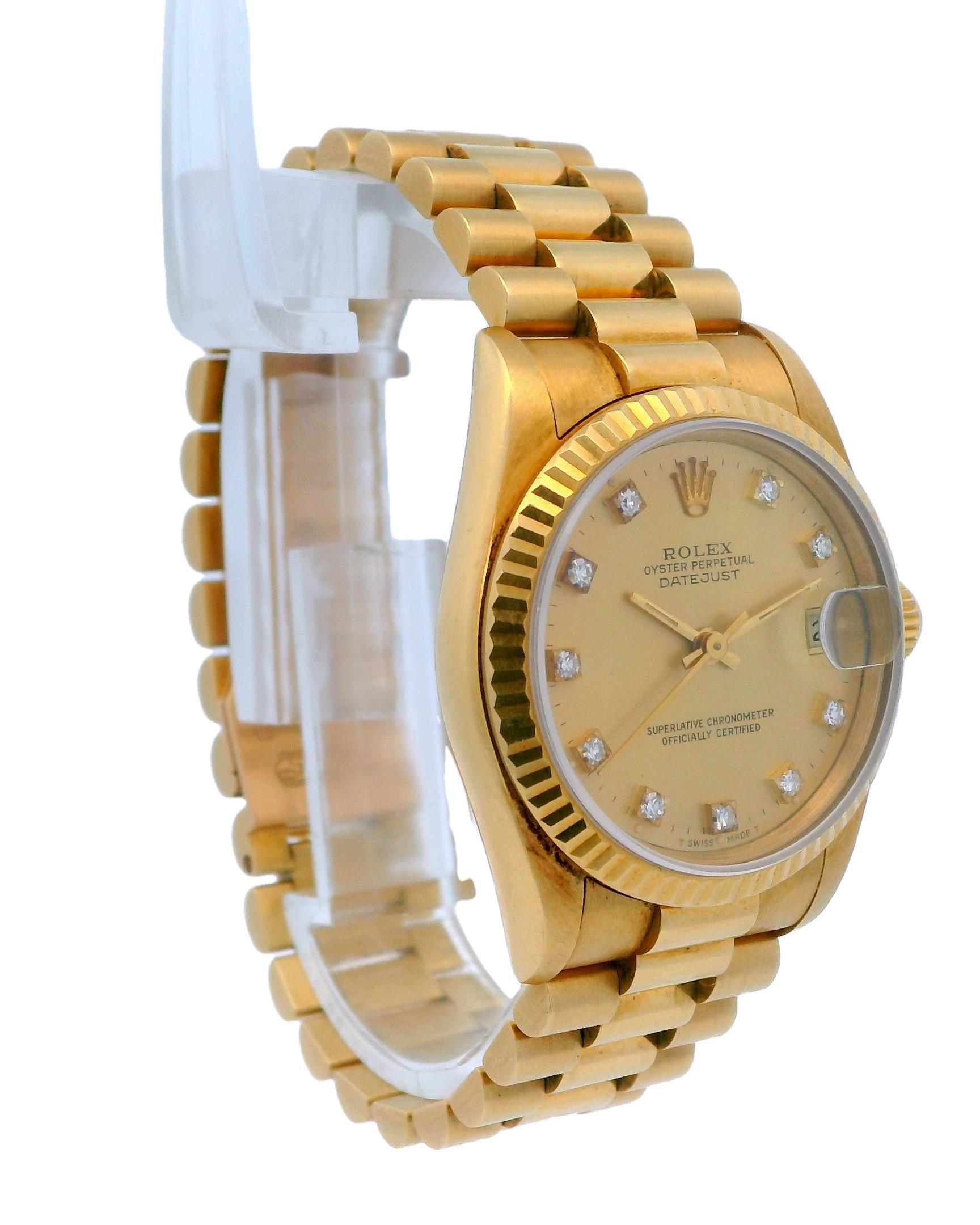 Rolex Oyster Perpetual Datejust 68278 Ladies Watch. 31mm 18k yellow gold case with 18K yellow gold fluted bezel. Champagne dial with gold hands and original factory diamond set hour marker. Date display at 3 o'clock position. 18K yellow gold