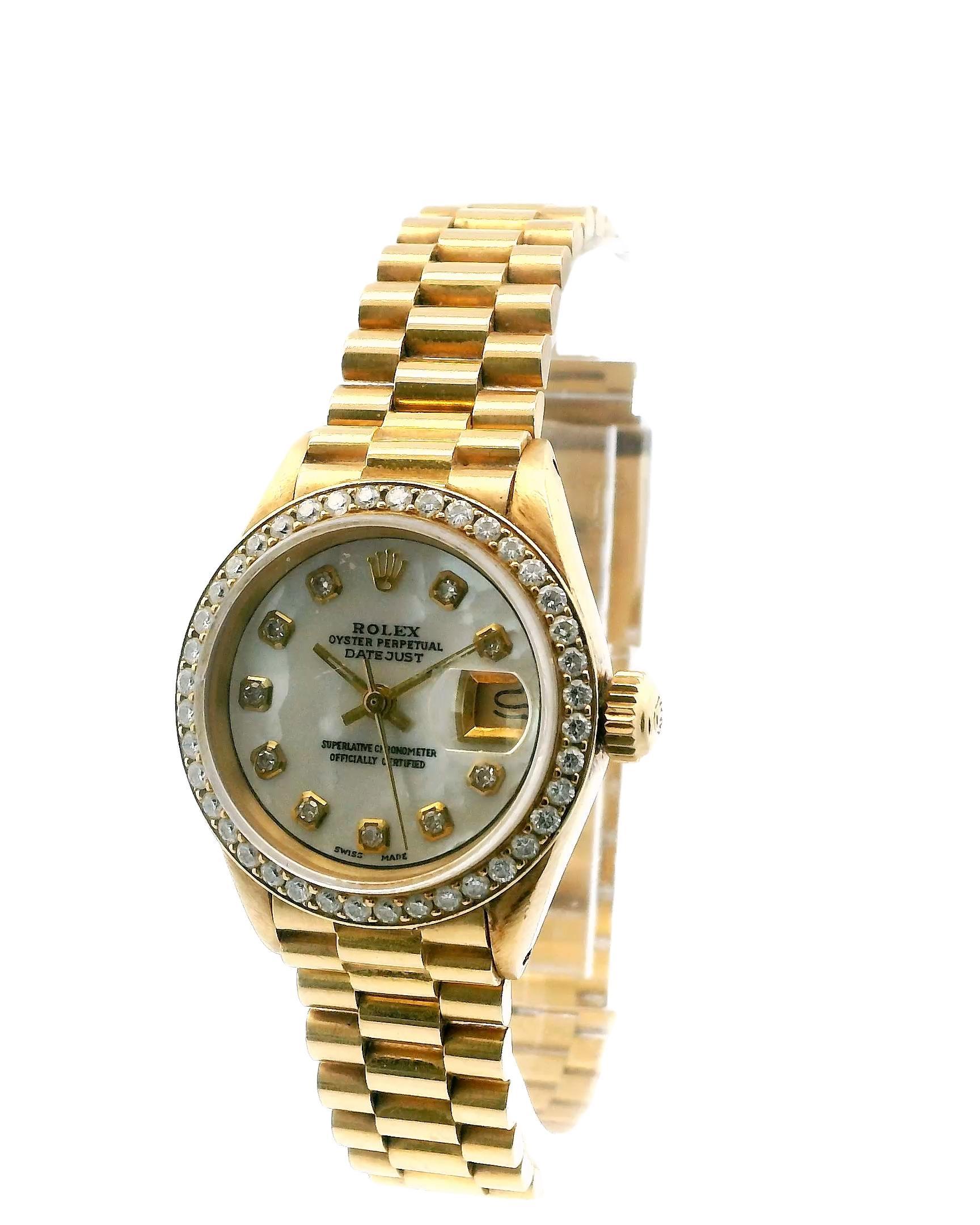 Rolex Datejust 6913 is a stunning ladies' watch that combines elegance and luxury. With a compact 26mm case crafted from 18K yellow gold, it exudes a sophisticated charm. The watch features an aftermarket diamond-set bezel that adds a touch of