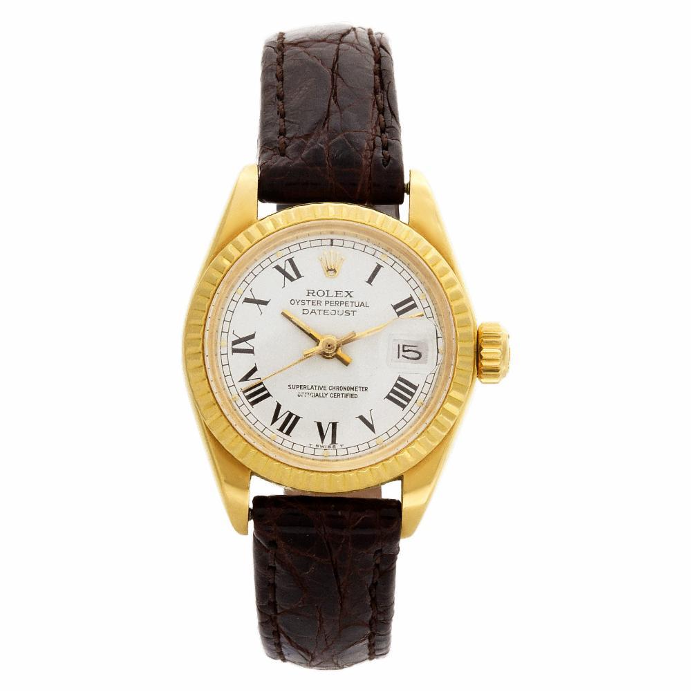 Rolex Datejust Reference #:6917. Ladies Rolex Datejust in 18k yellow gold, white dial with Roman numeral hour markers on a custom chocolate brown leather strap. Auto w/ sweep seconds and date. Ref 6917. Circa 1978. Fine Pre-owned Rolex Watch.