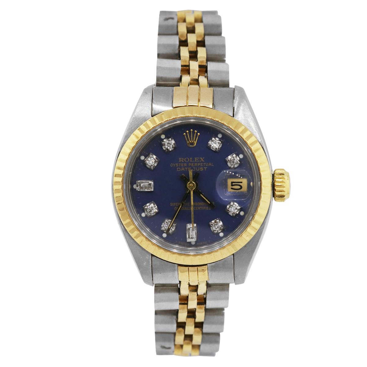 Brand: Rolex
MPN: 6917
Model: Datejust
Case Material: 18k yellow gold
Case Diameter: 26mm
Bezel: 18k yellow gold fluted fixed bezel
Dial: Aftermarket Blue dial with diamond hour markers, yellow gold hands and date window at the 3 o’clock