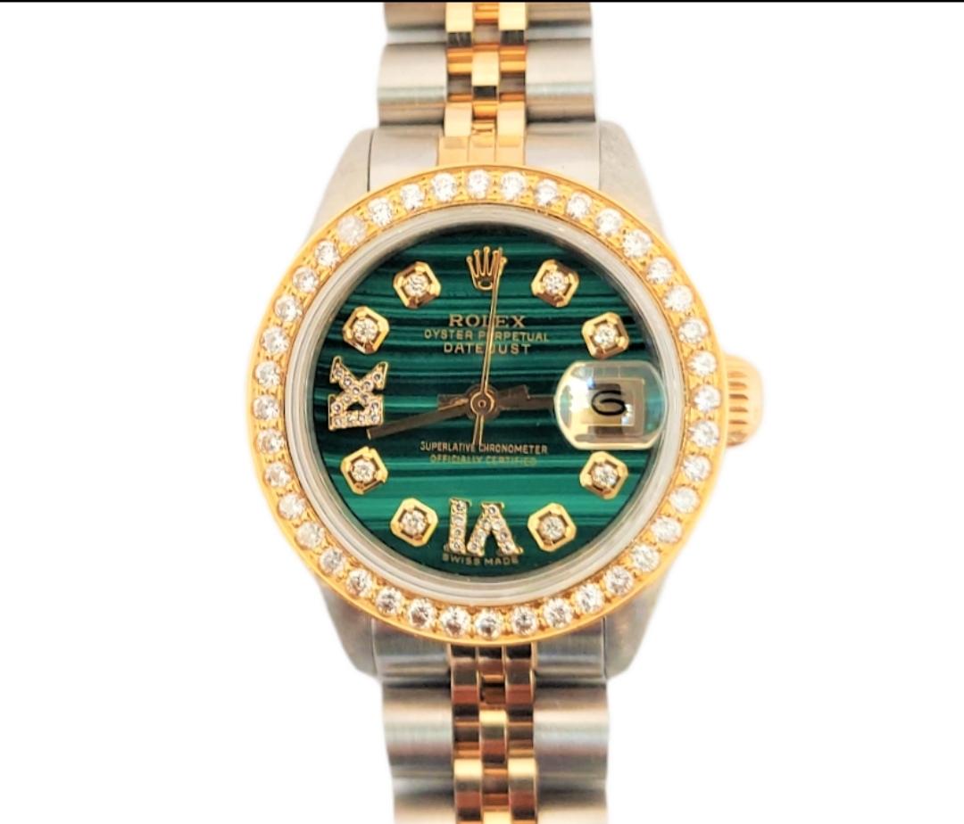 (Watch Description)
Brand - Rolex 
Model - 6917 Datejust 
Metals - Yellow Gold / Seel
Case size - 26, mm
Dial - Malachite Green Diamond Roman 
Crystal - Sapphire 
Movement - Automatic CAL-2130
Wrist Band - Two tone Jubilee
Wrist Size - 7 Inches

3
