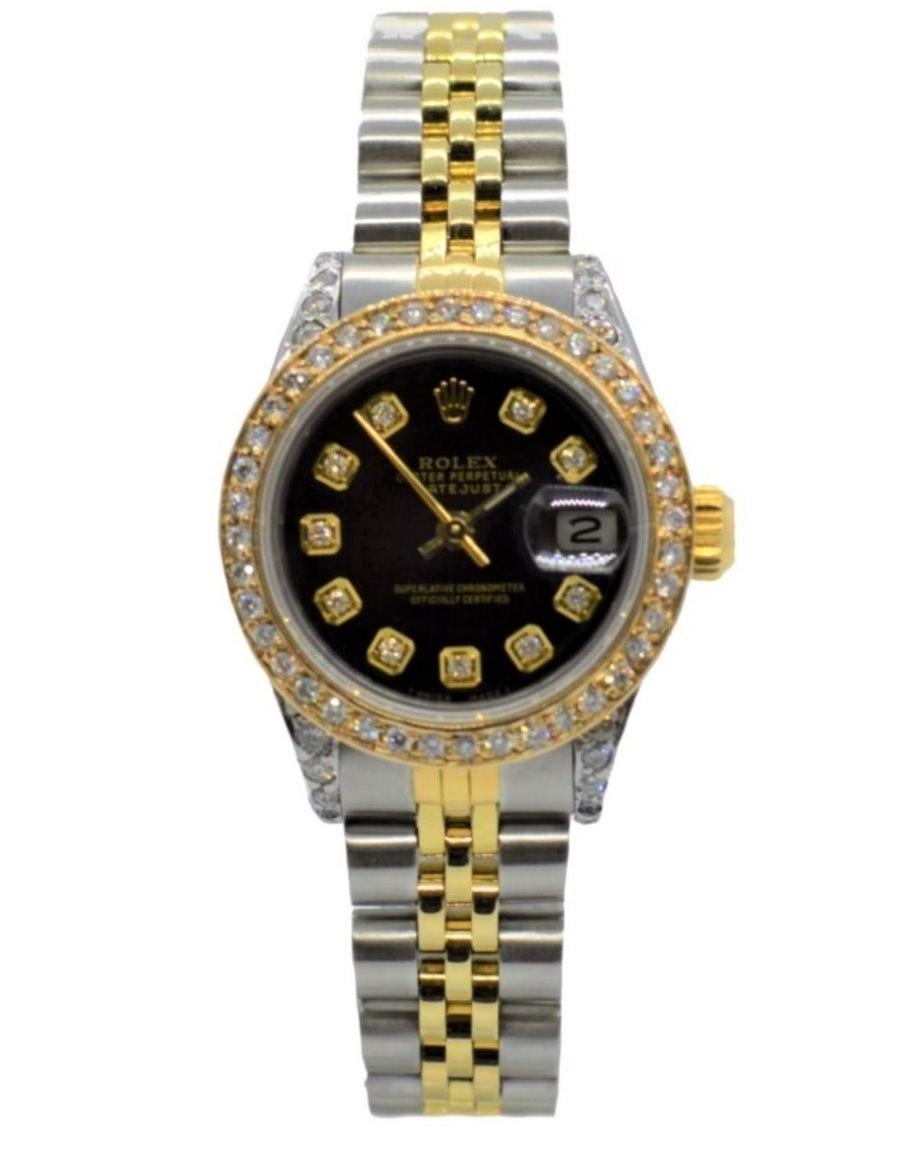 Brand - Rolex
Gender - Ladies
Condition - Pre owned
Model - 69173 datejust 
Metals - solid gold & stainless steel 
Case size - 26mm
Bezel - yellow gold diamond
Crystal - sapphire
Movement - automatic caliber 2135 
Dial - refinished black diamond