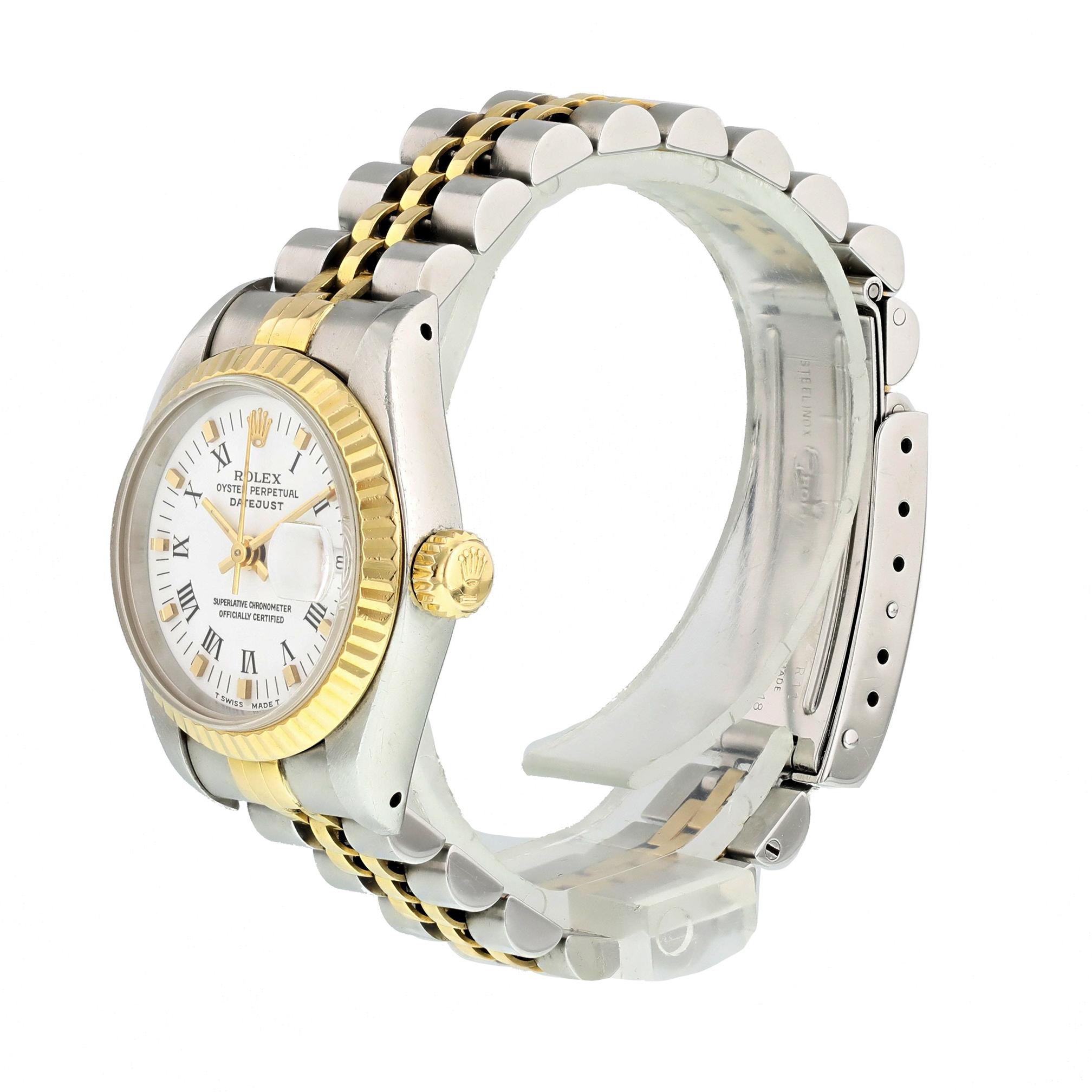 Rolex Datejust Professional 69173 Ladies Watch. 
26mm Stainless Steel case. 
Yellow Gold Stationary bezel. 
White dial with Luminous gold hands and roman numeral hour markers. 
Minute markers on the outer dial. 
Date display at the 3 o'clock