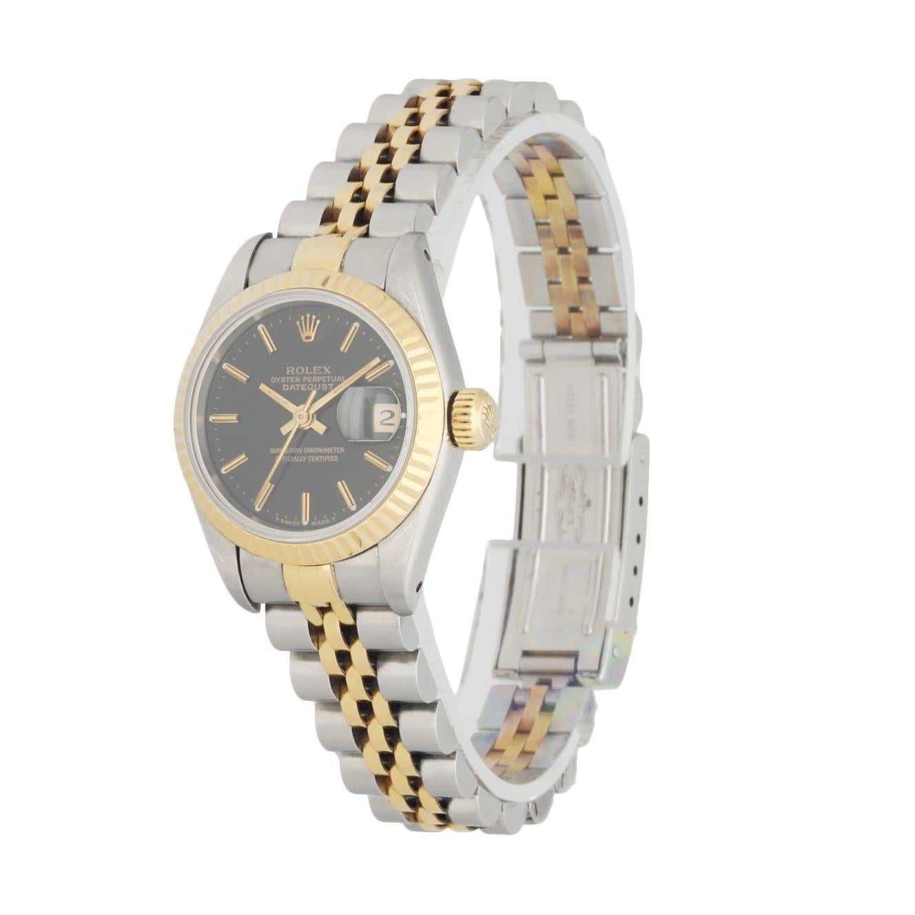 Rolex Datejust 69173 Ladies Watch. 26mm Stainless Steel case. 18K Yellow GoldÂ fluted bezel.Â Black dial with Luminous gold hands and index hour markers. Minute markers on the outer dial. Date display at the 3 o'clock position. Stainless Steel & 18K