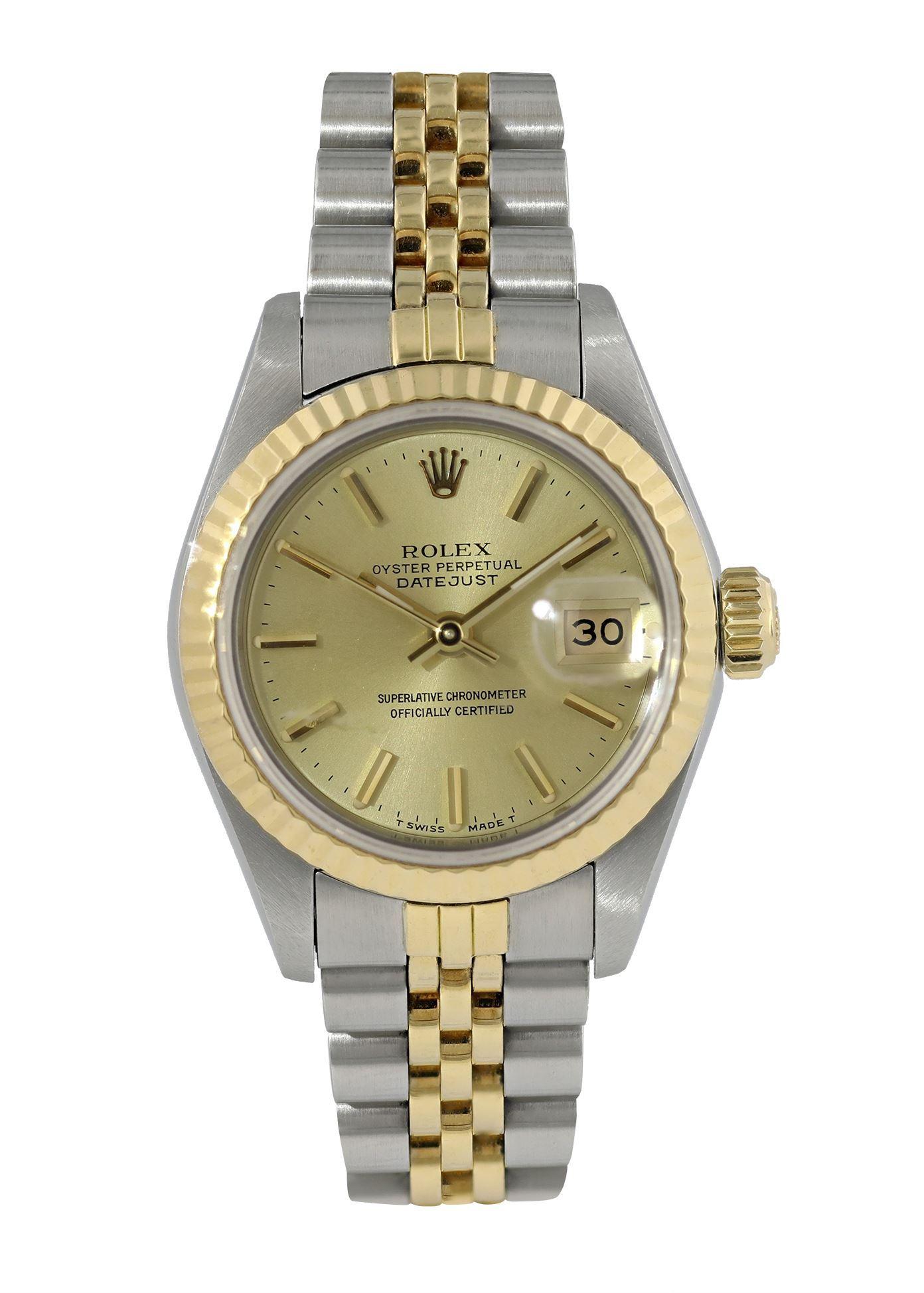 Rolex Datejust 69173 Ladies Watch. 
26mm Stainless Steel case. 
Yellow Gold Stationary bezel. 
Champagne dial with Luminous gold hands and index hour markers. 
Minute markers on the outer dial. 
Date display at the 3 o'clock position. 
Stainless