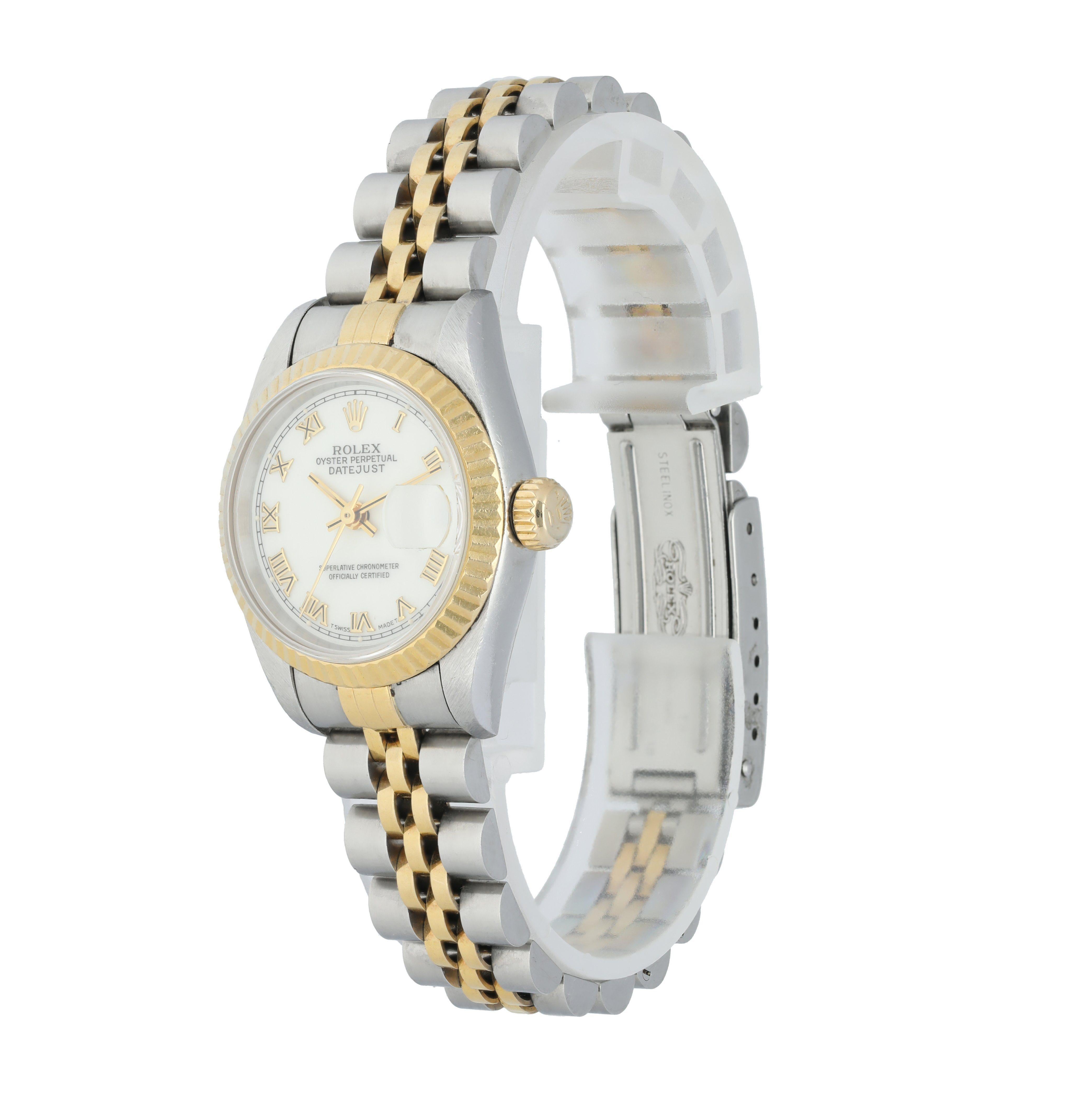Rolex Datejust 69173 Ladies Watch. 
26mm Stainless Steel case. 
Yellow Gold Stationary bezel. 
White dial with gold hands and Roman numeral hour markers. 
Minute markers on the outer dial. 
Date display at the 3 o'clock position. 
Two-Tone Stainless