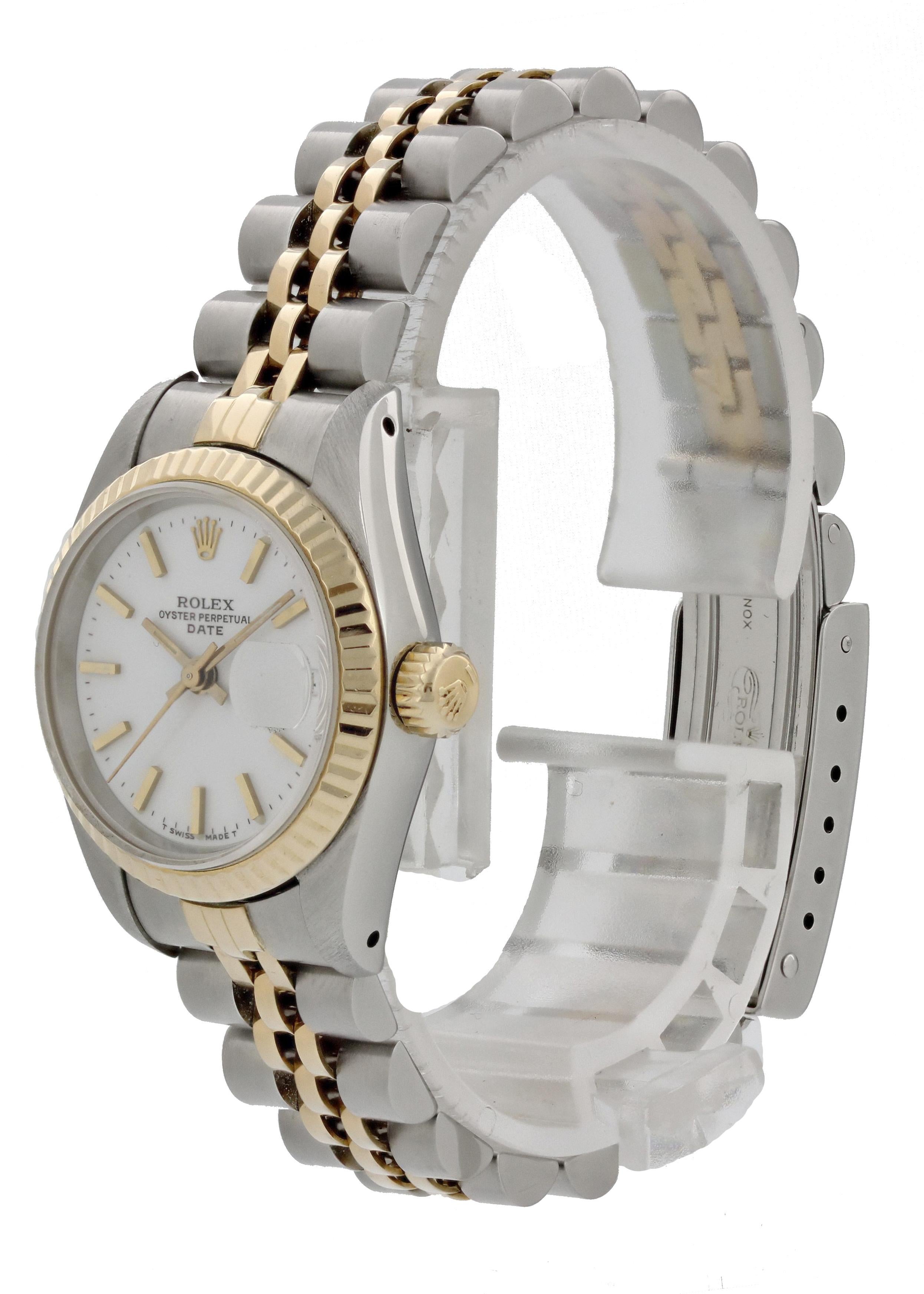 Rolex Datejust 69173 Ladies Watch. 
26mm Stainless Steel case. 
Yellow Gold Stationary bezel. 
White dial with Luminous gold hands and index hour markers. 
Minute markers on the outer dial. 
Date display at the 3 o'clock position. 
Stainless Steel