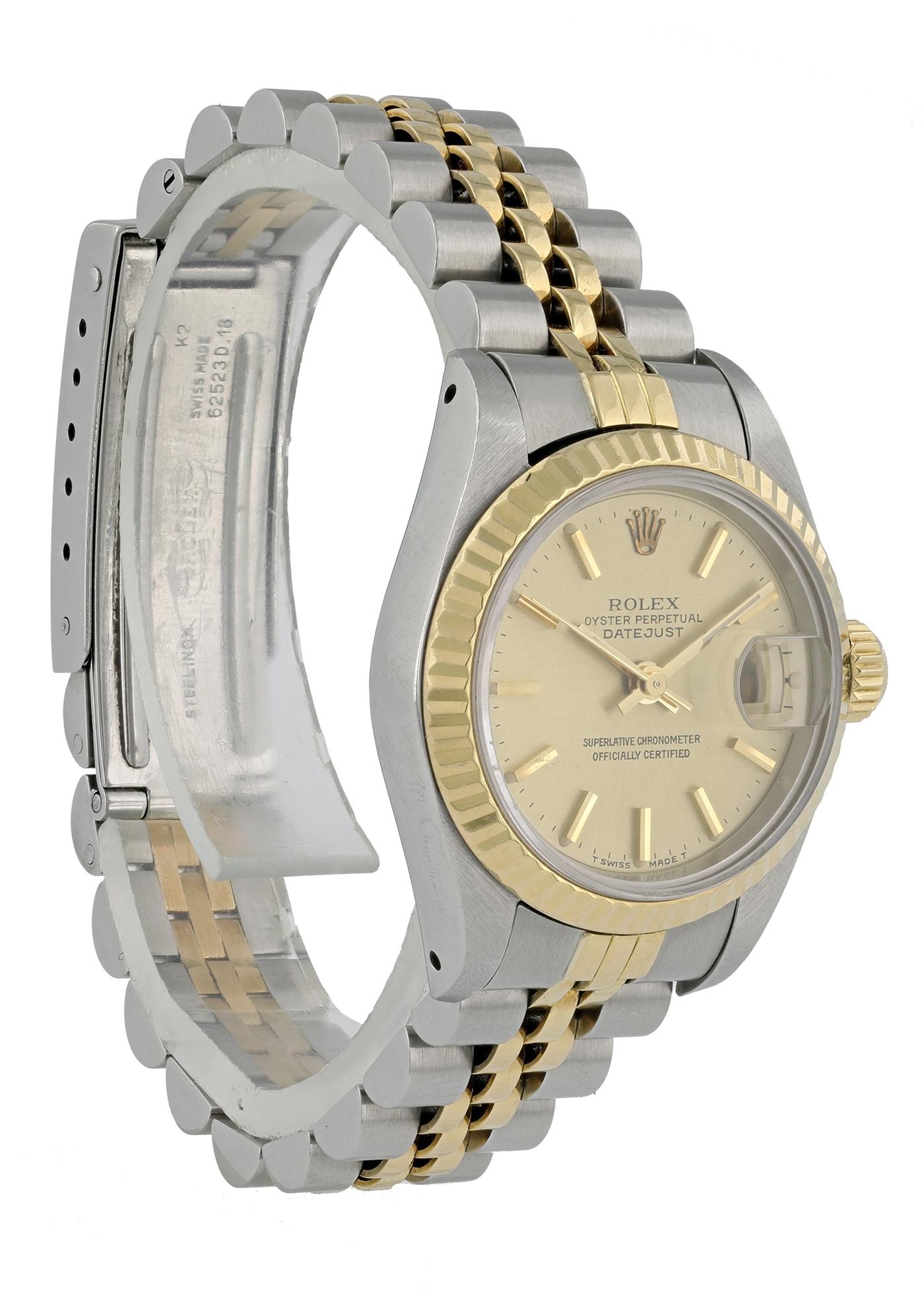 Rolex Datejust 69173 Ladies Watch. 
26mm Stainless Steel case. 
Yellow Gold Stationary bezel. 
Champagne dial with Luminous gold hands and index hour markers. 
Minute markers on the outer dial. 
Date display at the 3 o'clock position. 
Stainless