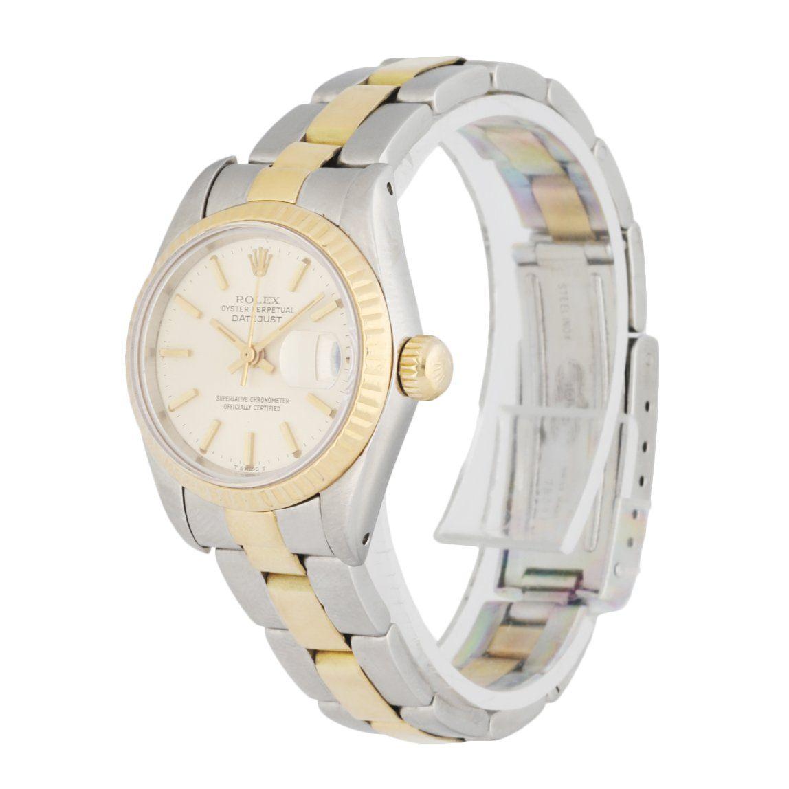 Rolex Datejust 69173 Ladies Watch. 26mm Stainless Steel case. 18K Yellow GoldÂ fluted bezel. Off-WhiteÂ dial with Luminous gold hands and index hour markers. Minute markers on the outer dial. Date display at the 3 o'clock position. Stainless steel &