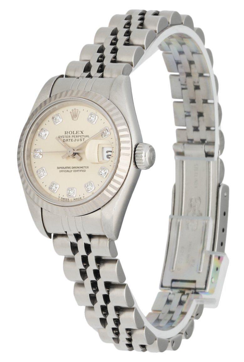 Rolex Datejust 69174 Ladies Watch. 26mm Stainless Steel case. 18K White Gold Stationary bezel. Silver dial with Steel hands and Factory diamond hour markers.Minute markers on the outer dial. Date display at the 3 o'clock position. Stainless Steel