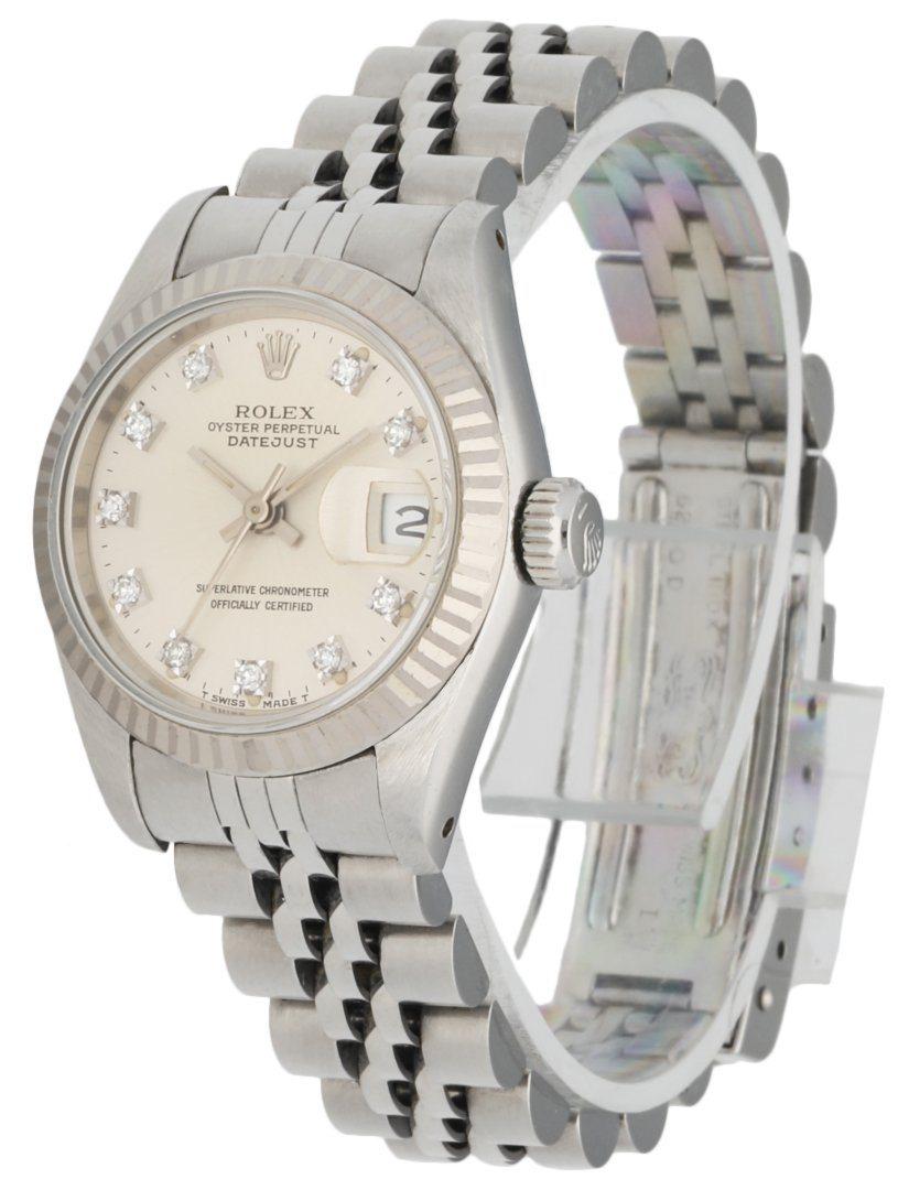 Rolex Datejust 69174 Ladies Watch. 26mm Stainless Steel Case with 18K White Gold fluted bezel. Silver dial with Luminous Steel hands and factory diamond hour markers. Minute markers on the outer dial. Date display at the 3 o'clock position.